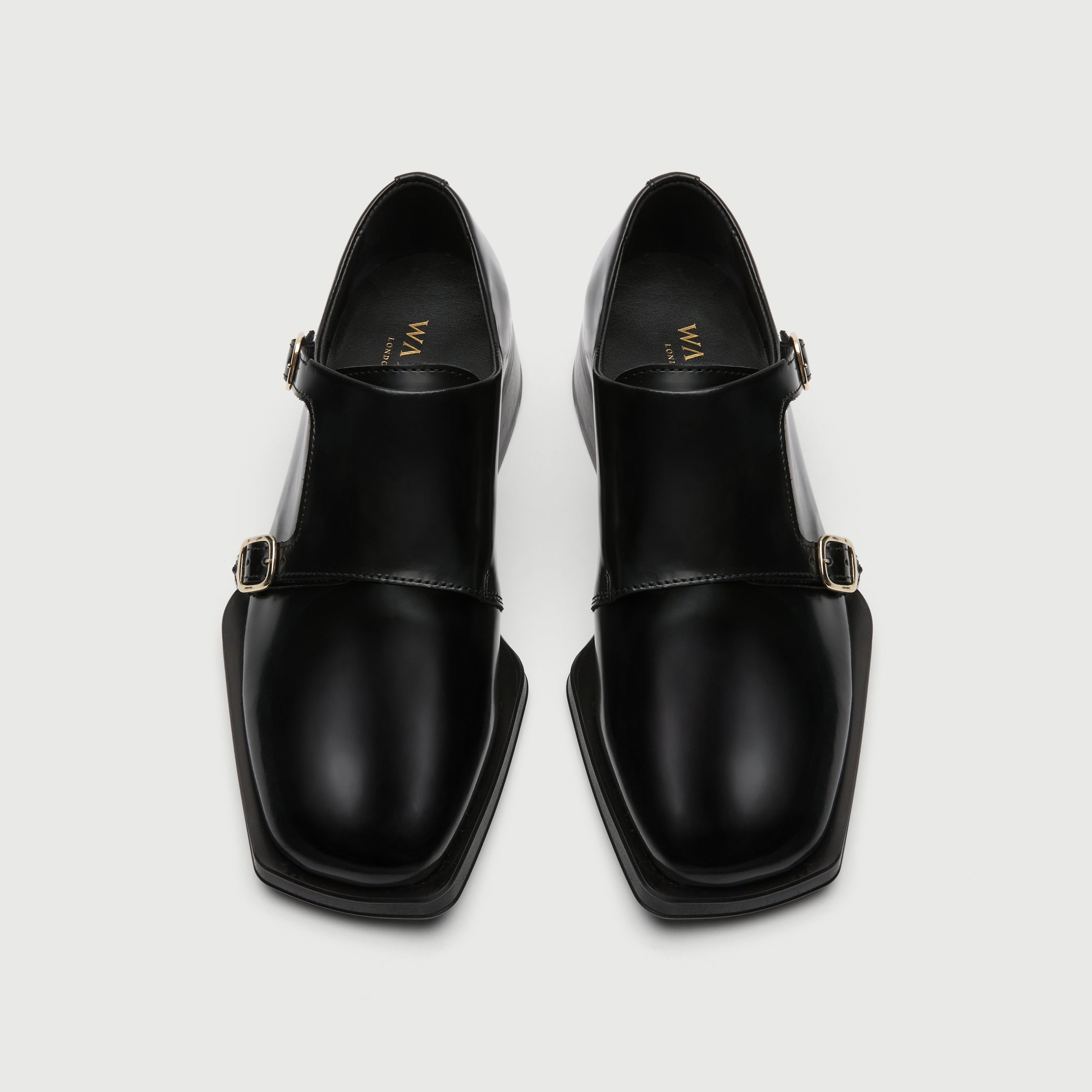 Black leather shoe with a buckle on a light grey background - Walk London Abbey Monk Shoe Birds eye view