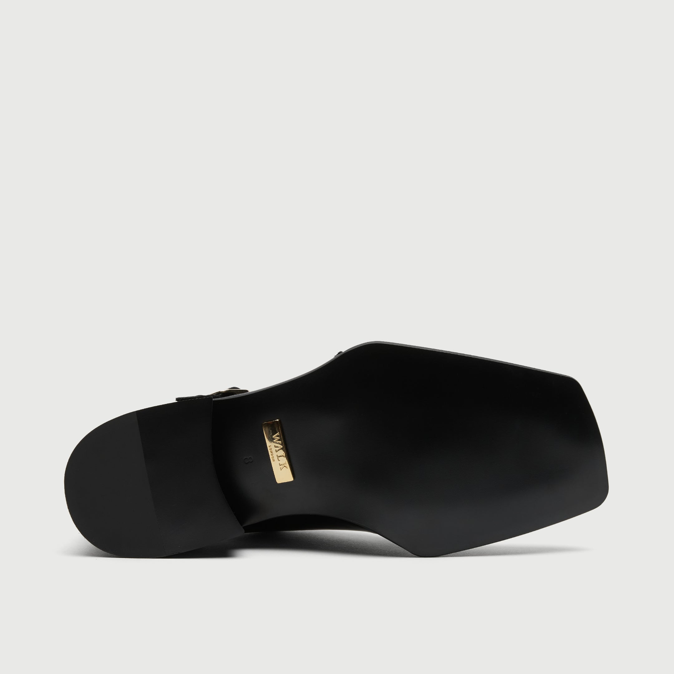 Black leather shoe with a buckle on a light grey background - Walk London Abbey Monk Shoe - View of Sole Bottom