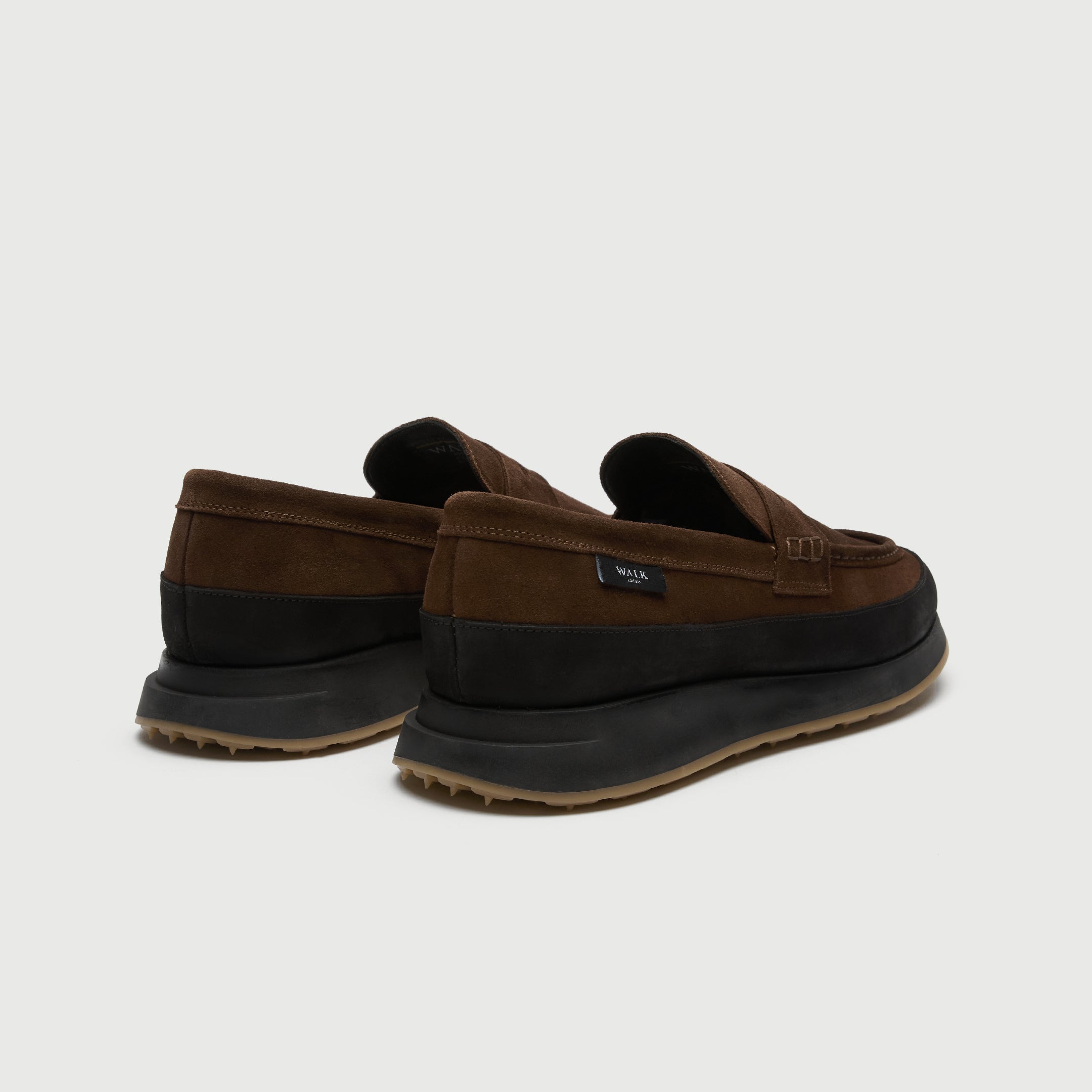 Walk London Battersea Saddle Hybrid Loafer in brown and black suede heel view showing branded tag