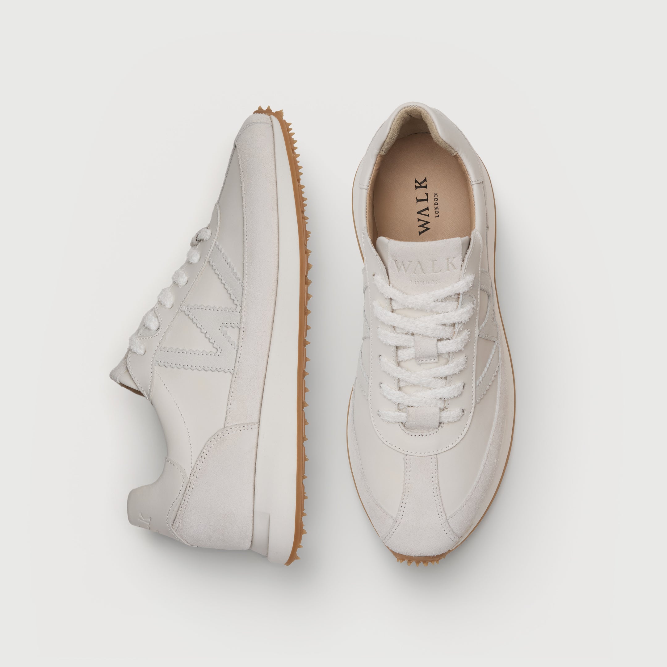 Walk London Chiswick white leather trainer top and side view showing textured white laces and tan sole and neutral liner with black branding