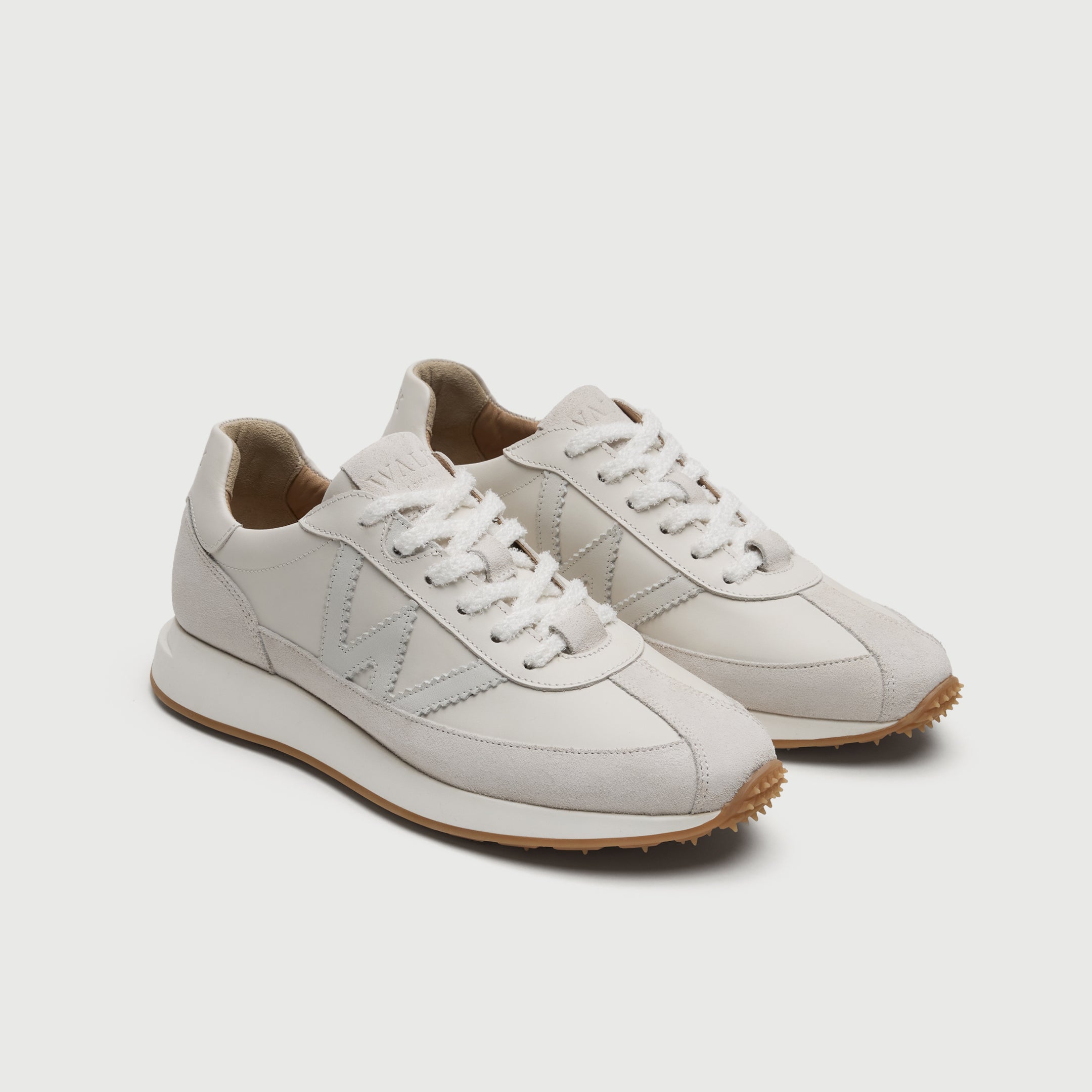 Walk London Chiswick white leather trainer three quarter view showing textured white laces