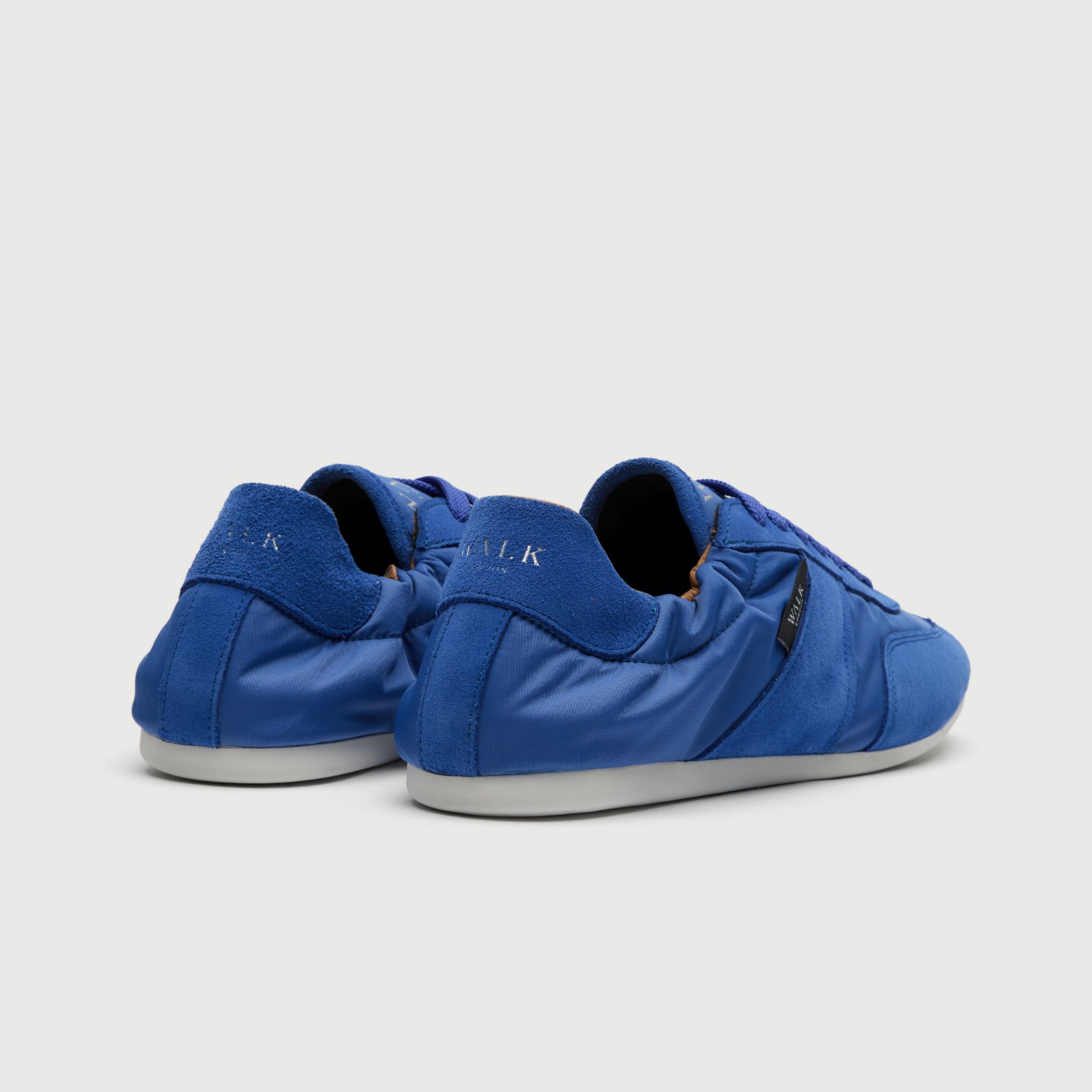Walk London Firenze Trainer in blue suede and textile heel view
