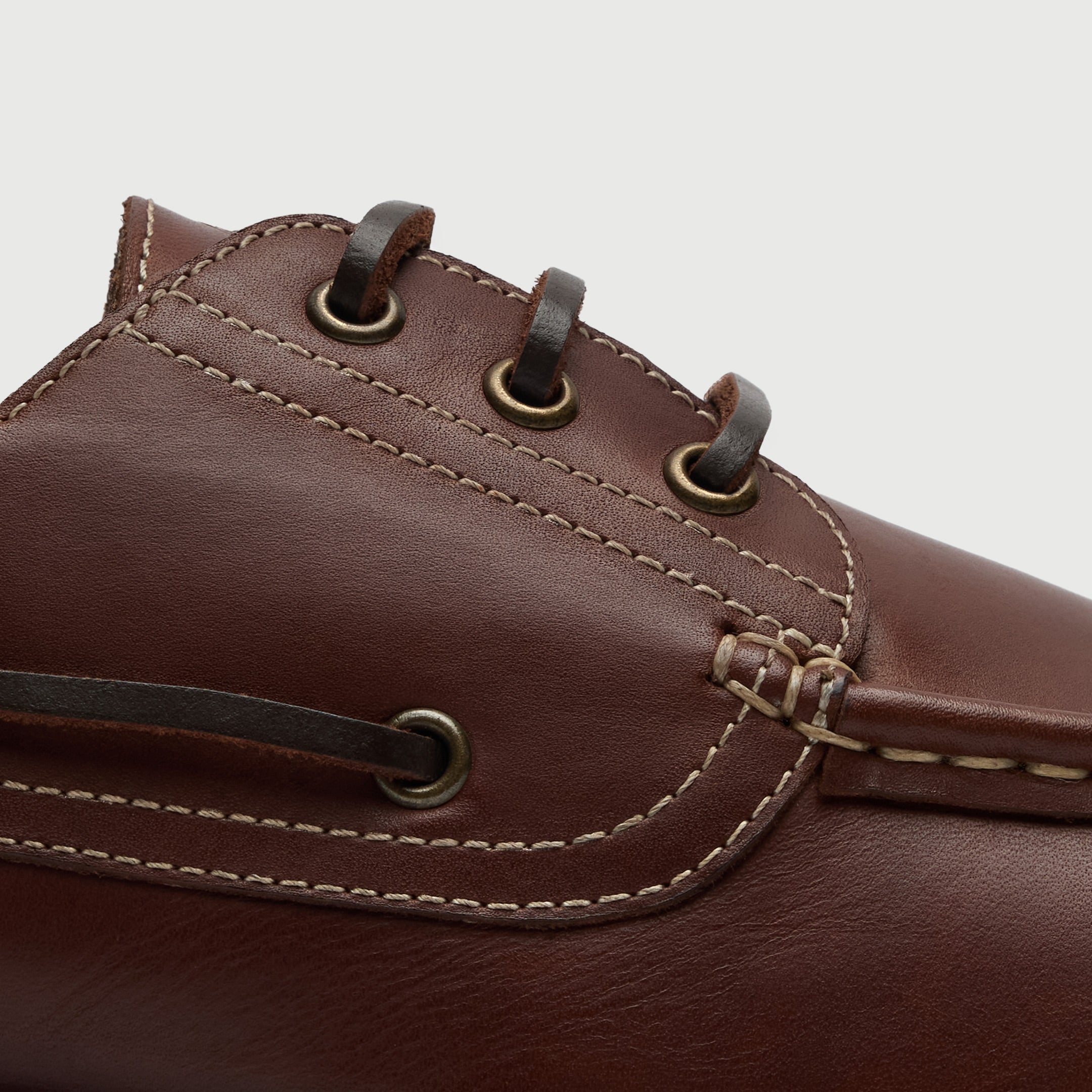 Walk London Hackney Boat Shoes in tan leather with contrast stitch close up view of leather laces and eyelets