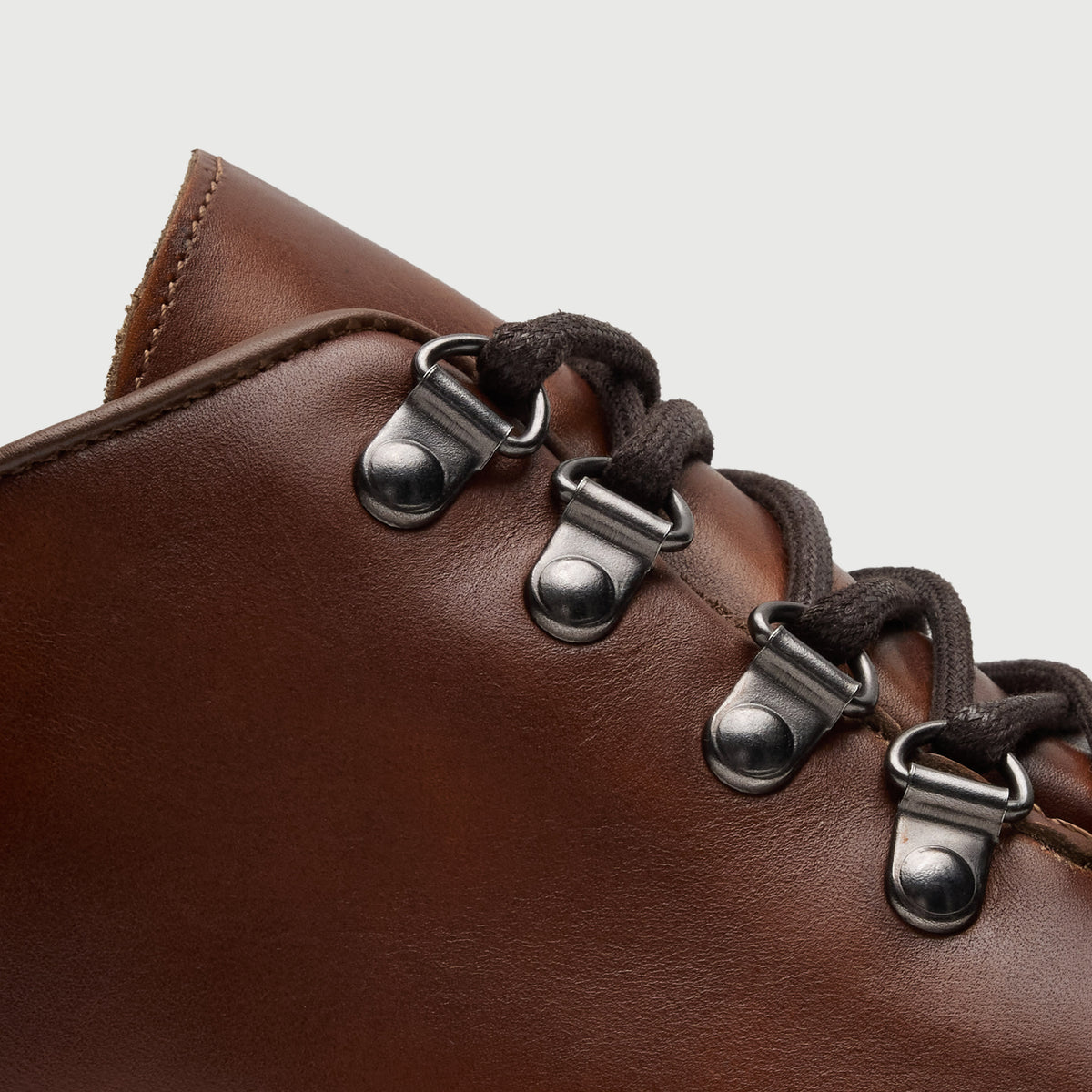 Walk London Hartford Hiking Style Shoe in Tan Leather detail view of gunmetal toned d-rings and brown laces