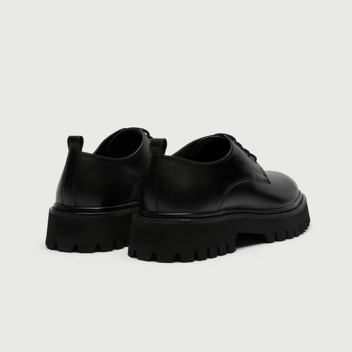 Walk London Hopper Black Leather Derby Shoe with chunky sole heel view showing debossed branding and pull tabs