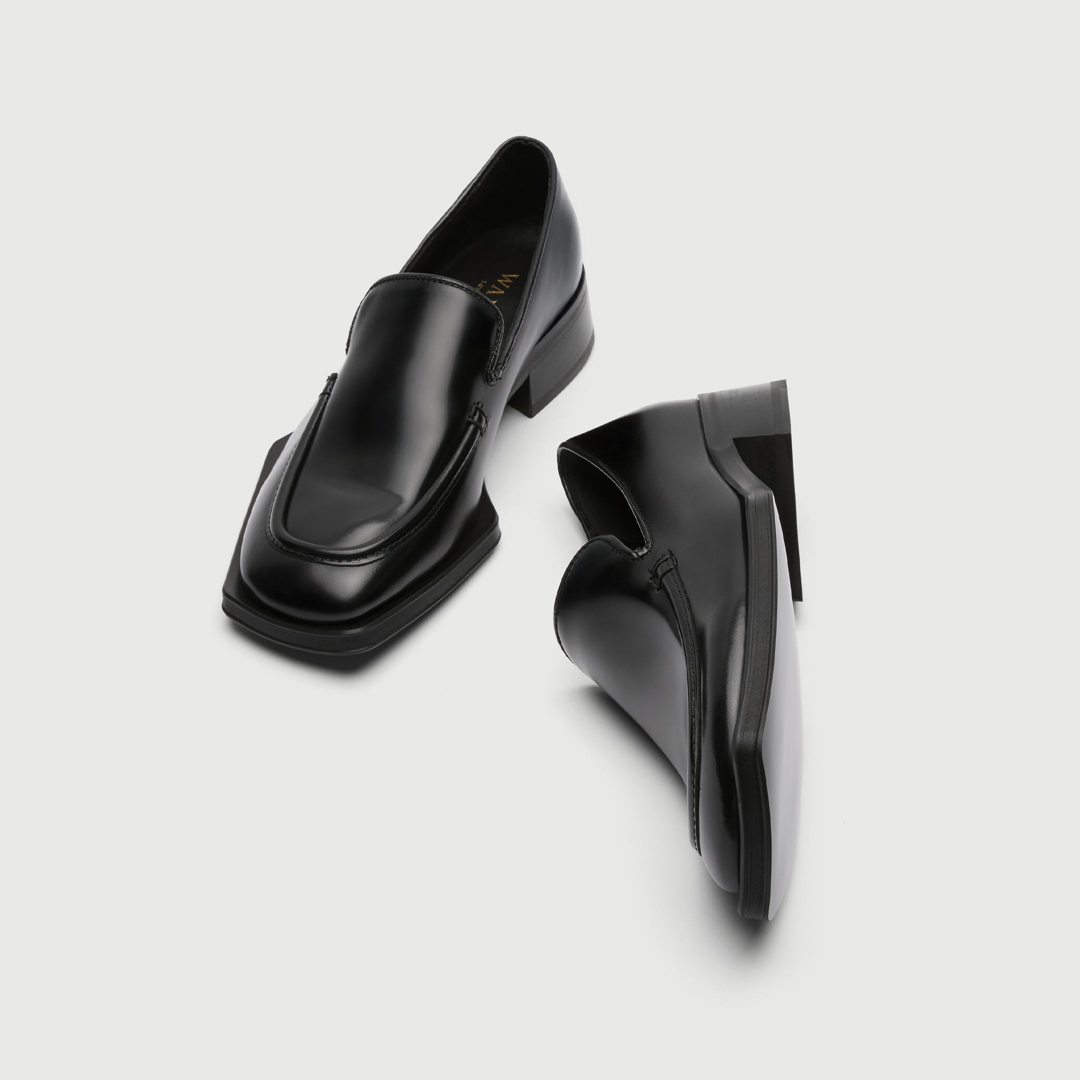 Black leather loafer with a light grey background - Walk London Abbey Loafer Top View