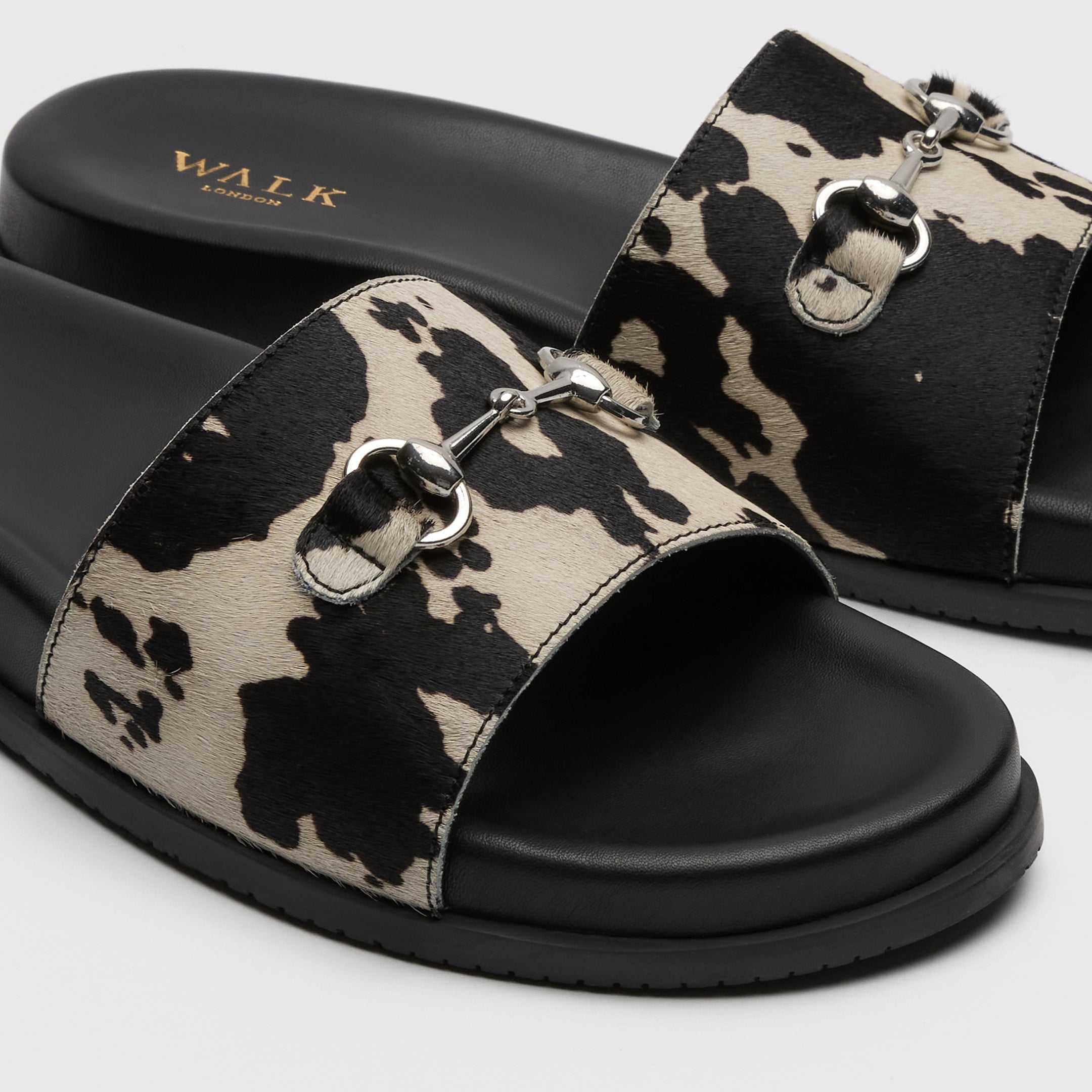 Walk London Breeze Trim Men's Leather Slider Sandal in cow print detail view