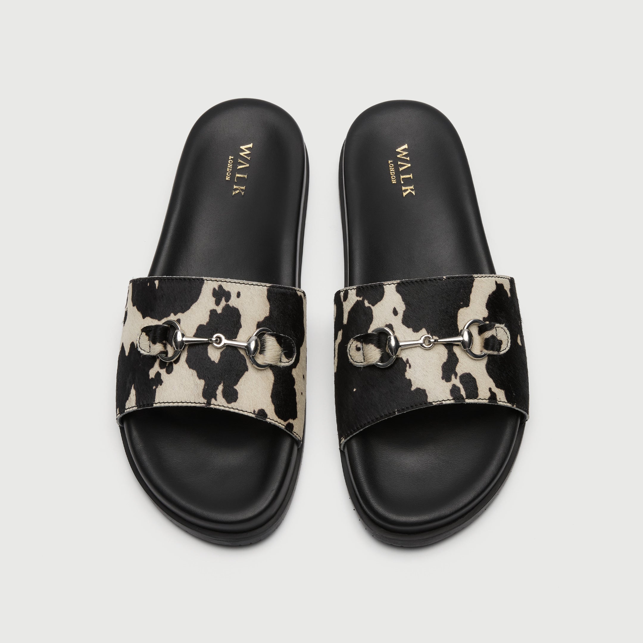 Walk London Breeze Trim Men's Leather Slider Sandal in cow print top view