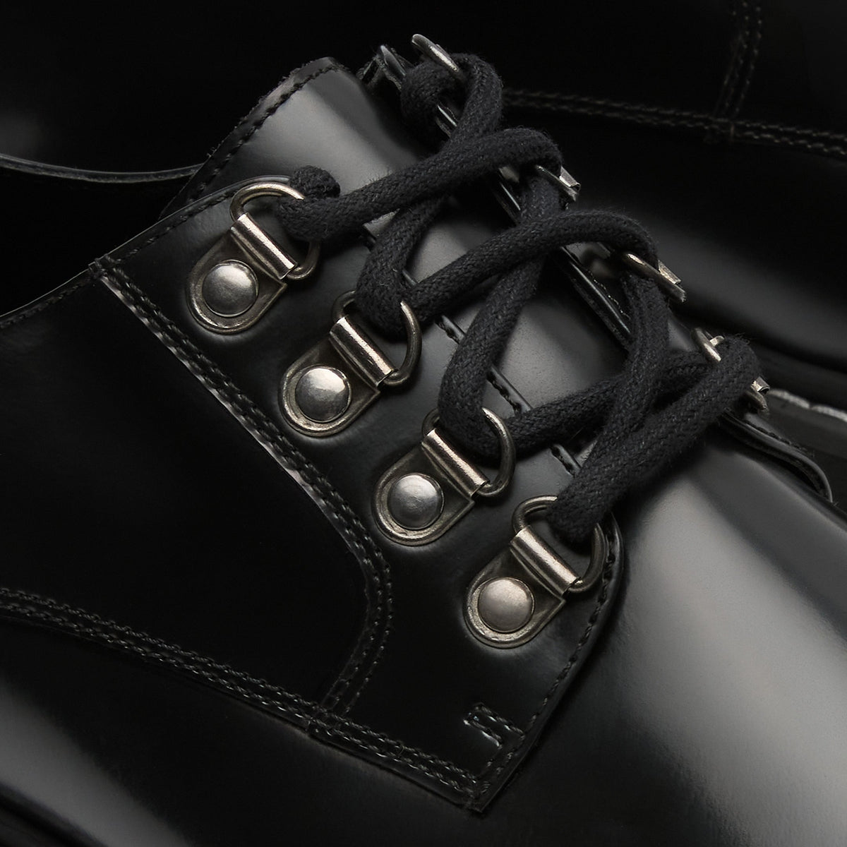 Walk London Bromley Hiking Shoes in Black Leather close up view of black lace and d-rings