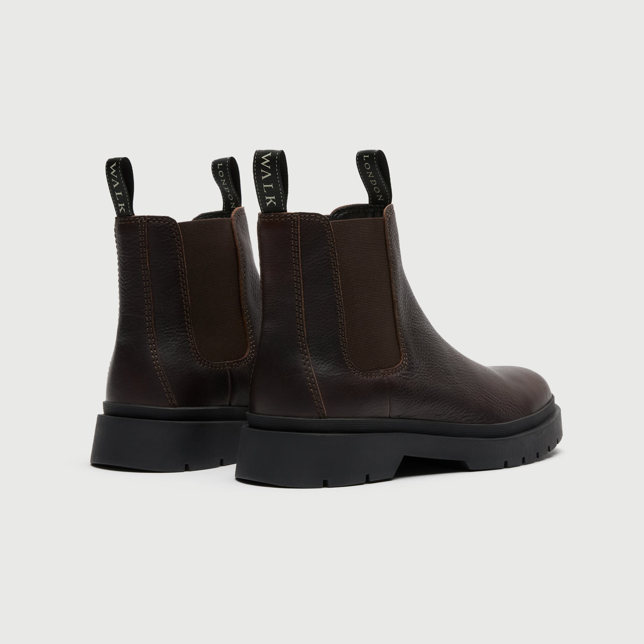 Dark brown leather Chelsea boot on a light grey background - Walk London Callum Seam Chelsea Boot - Back of Boot