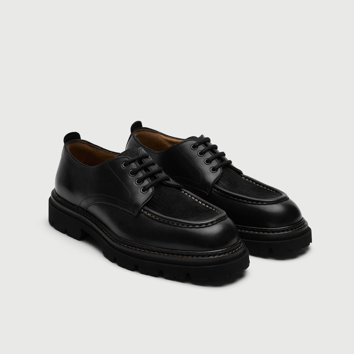 Walk London Farringdon Apron Shoe in black leather three quarter view with a cord vamp and black laces