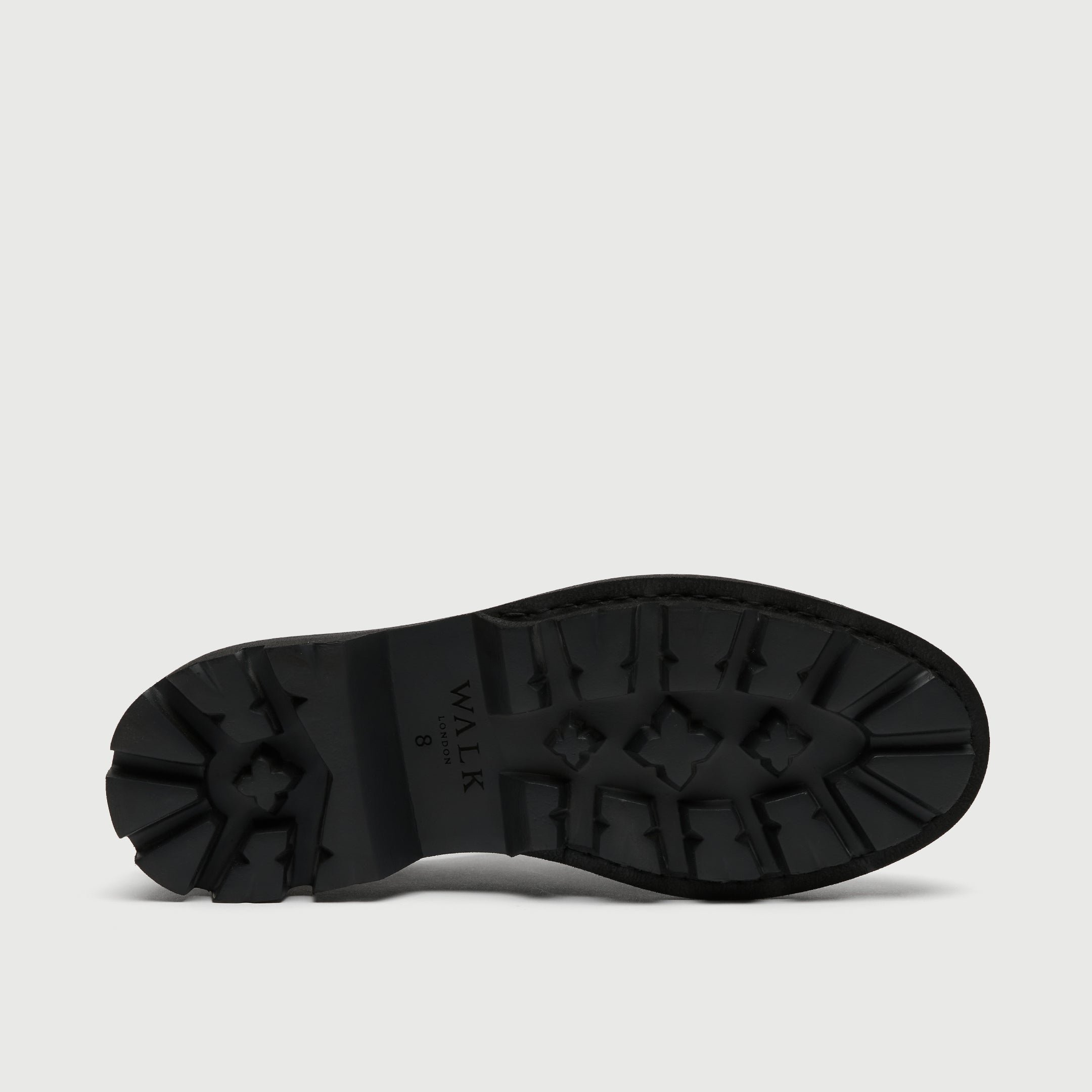 Black sole of a shoe on a light gray background - Black leather Walk London Felix brogue shoe