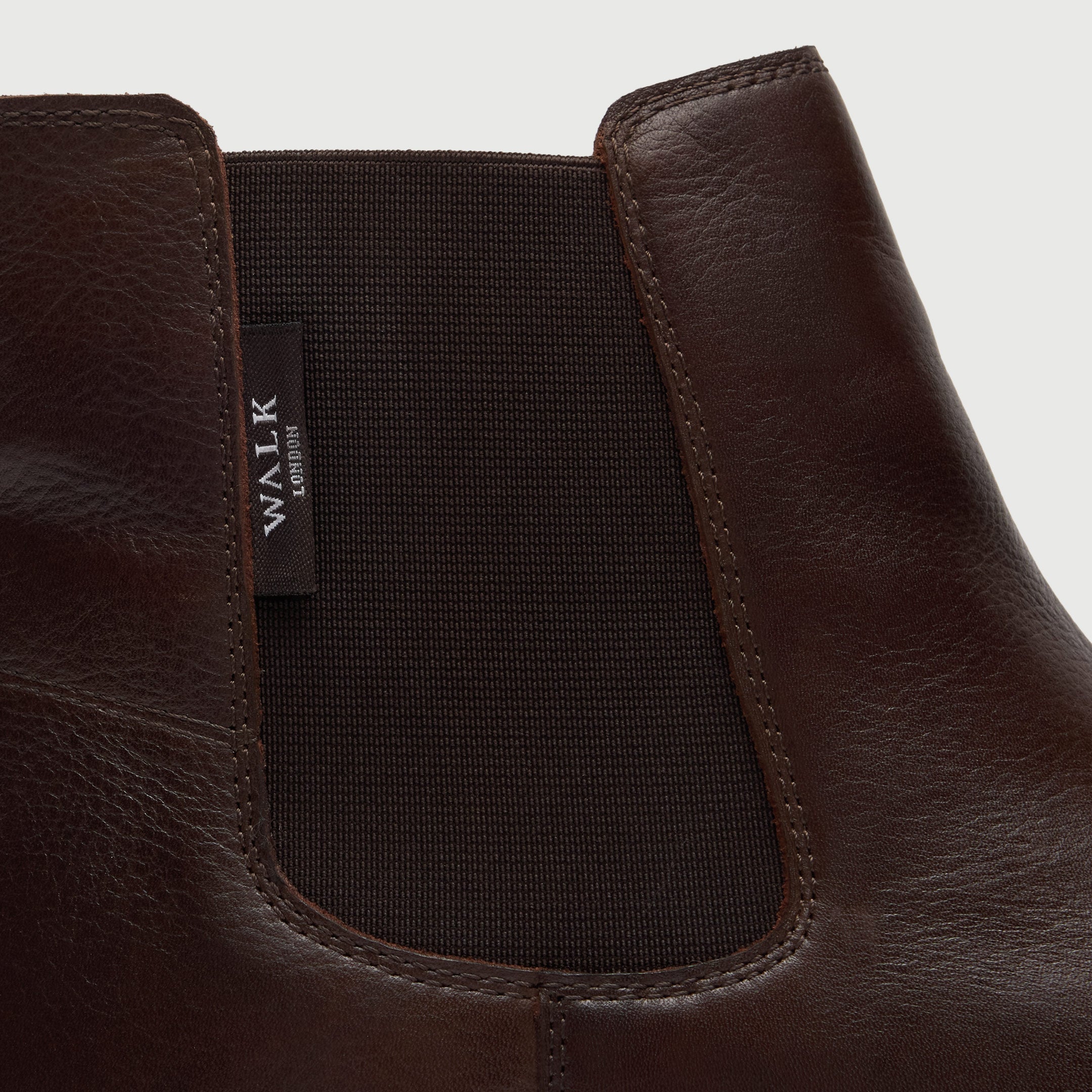 Walk London Hackney Chelsea Boot in Brown Leather close up view of elastic panel and branded label