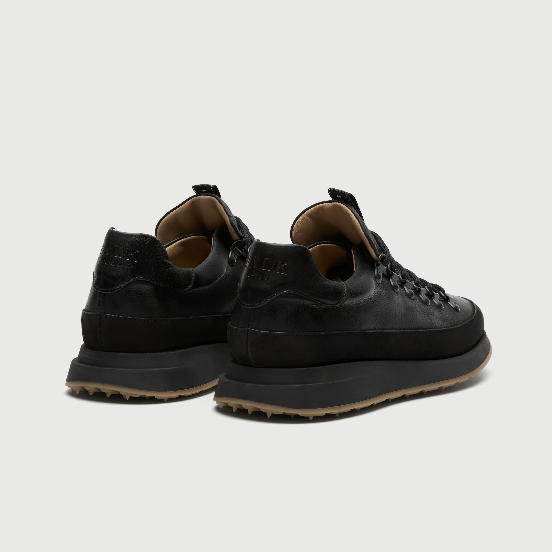 Black leather walk london hampsetad hiking sneaker on a light grey background