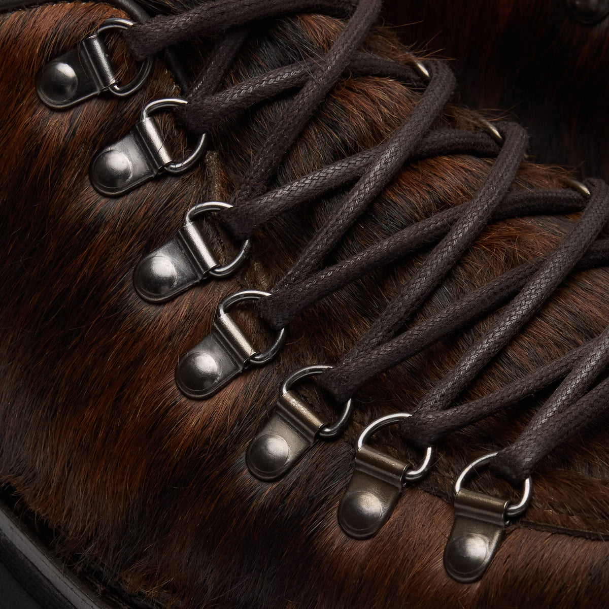 Walk London Hartford Hiking Style Shoe in Brown Pony Hair close up above of silver toned d-rings and brown laces and tongue