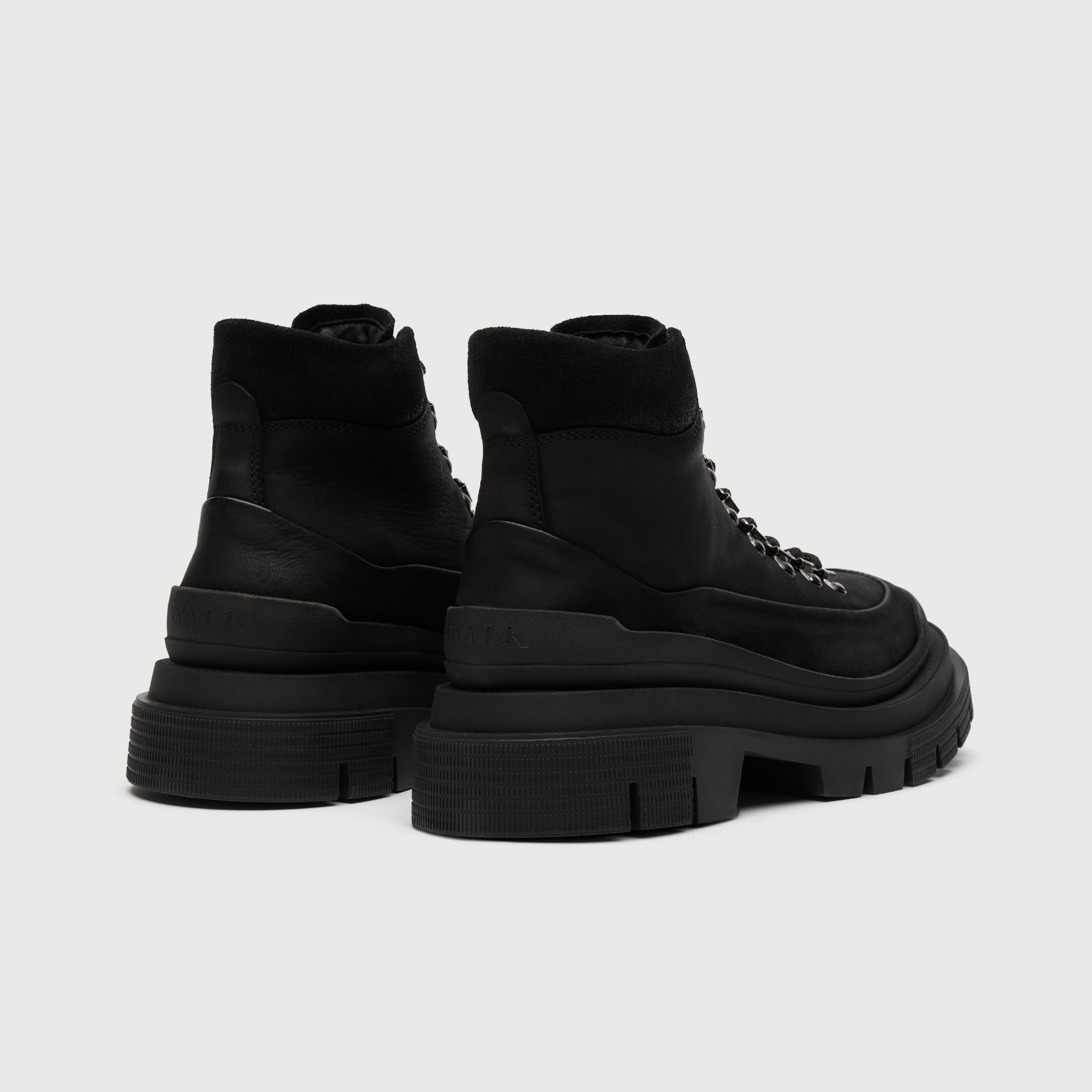 Walk London back shot of black Highgate hiking boot with thick sole on a light grey background