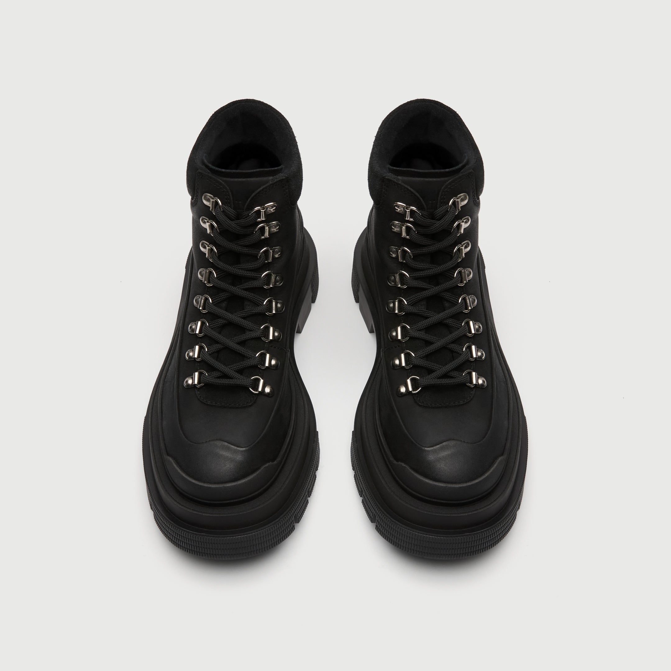 Walk London top view of black Highgate hiking boot with thick sole on a light grey background