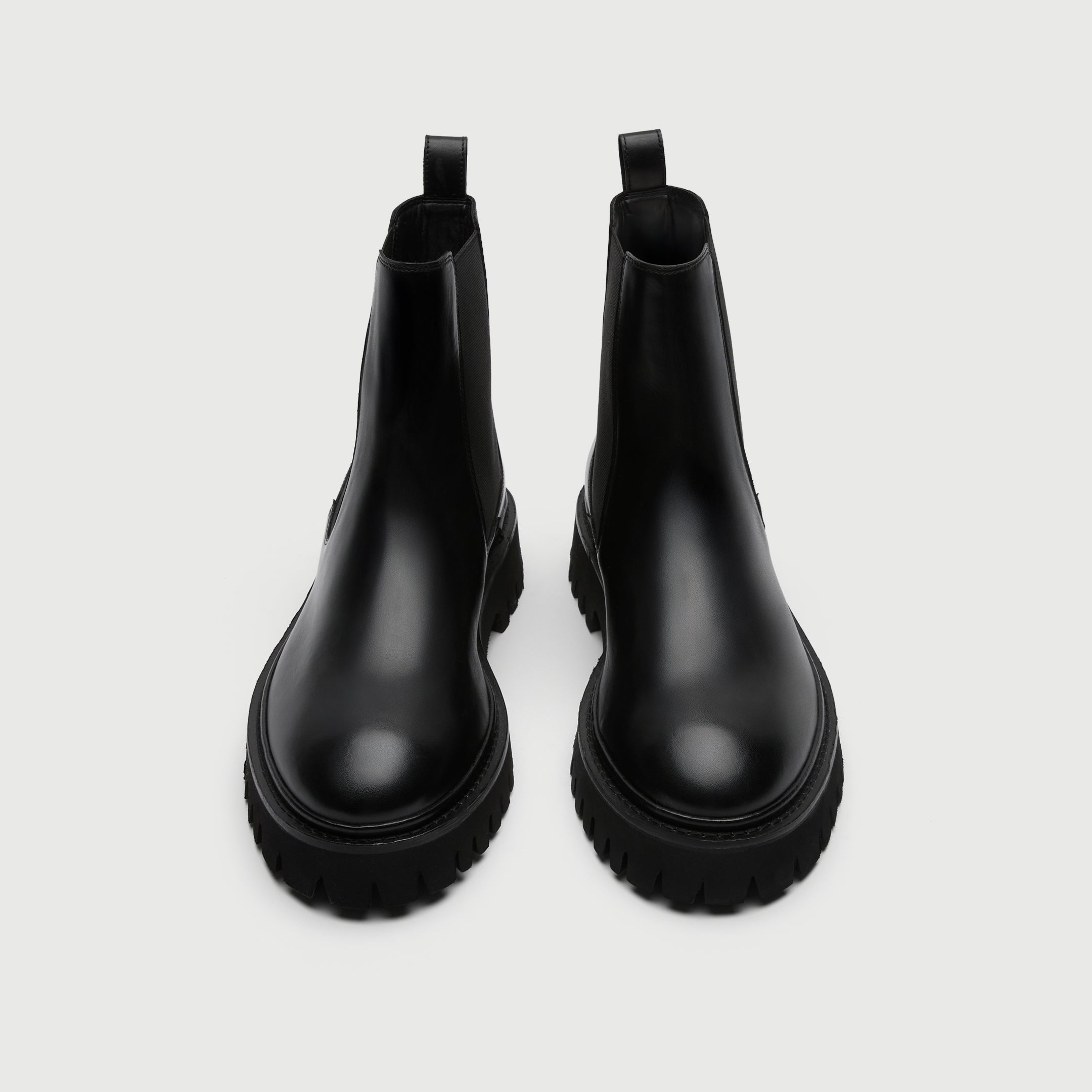 Pair of black rubber boots from Walk London Shoes on a light grey background