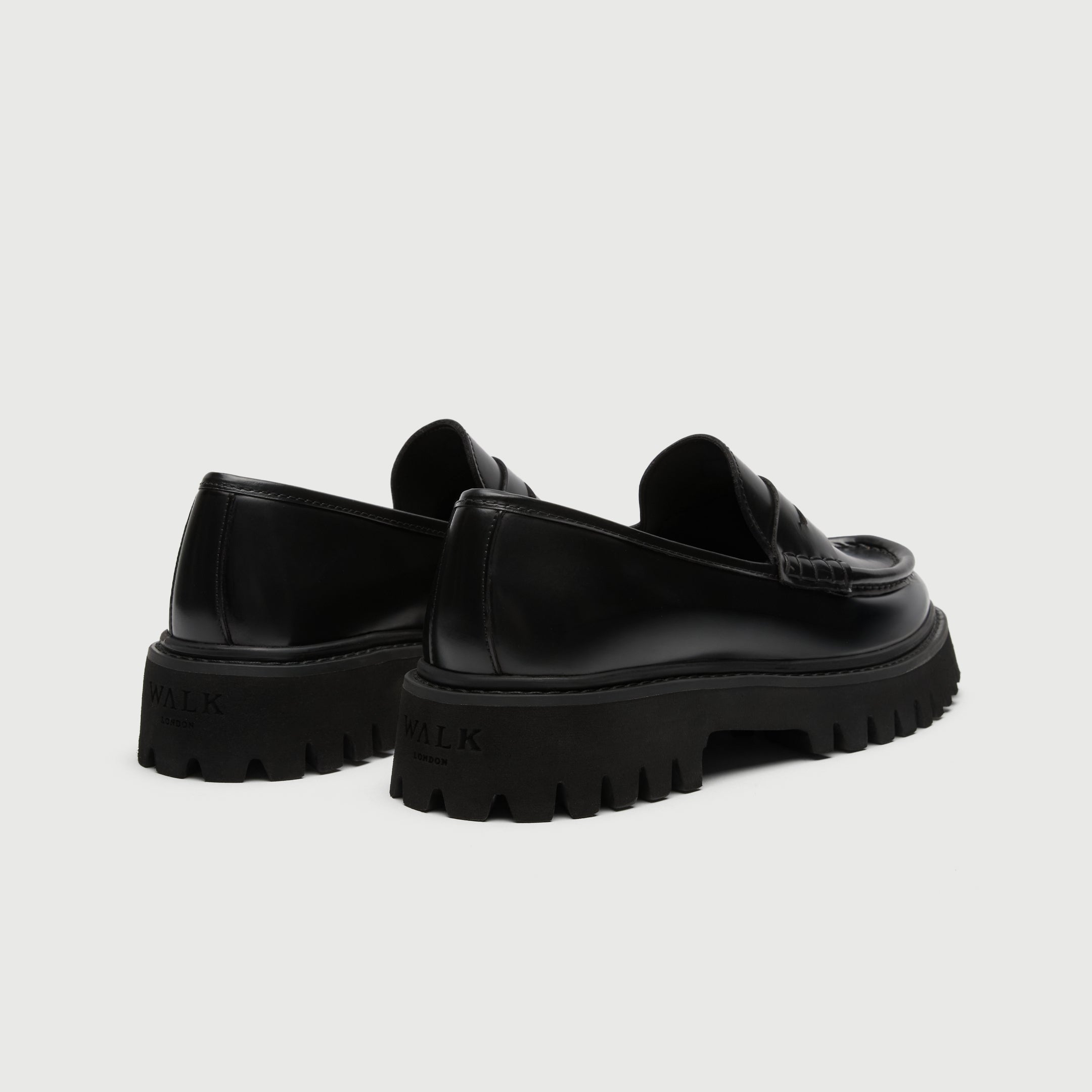Walk London Hopper Saddle Loafers in Black Smooth Leather heel view showing debossed branding on heel of chunky sole