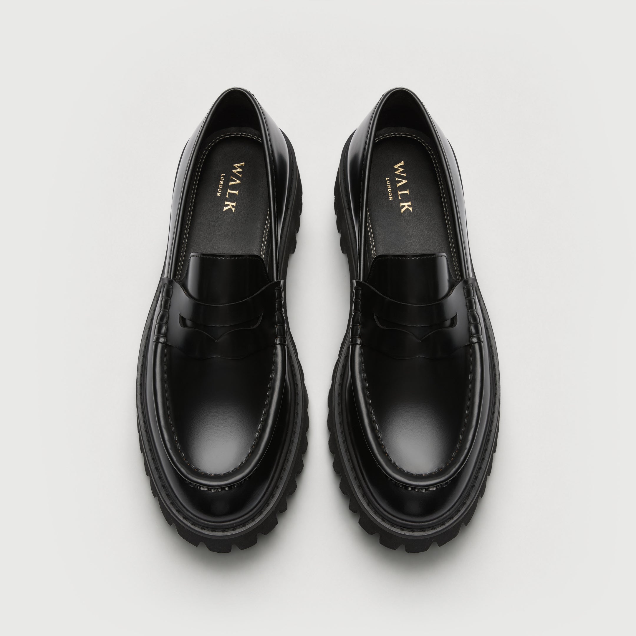 Walk London Hopper Saddle Loafers in Black Smooth Leather top view with gold foil branded insole, apron seam, and chunky sole