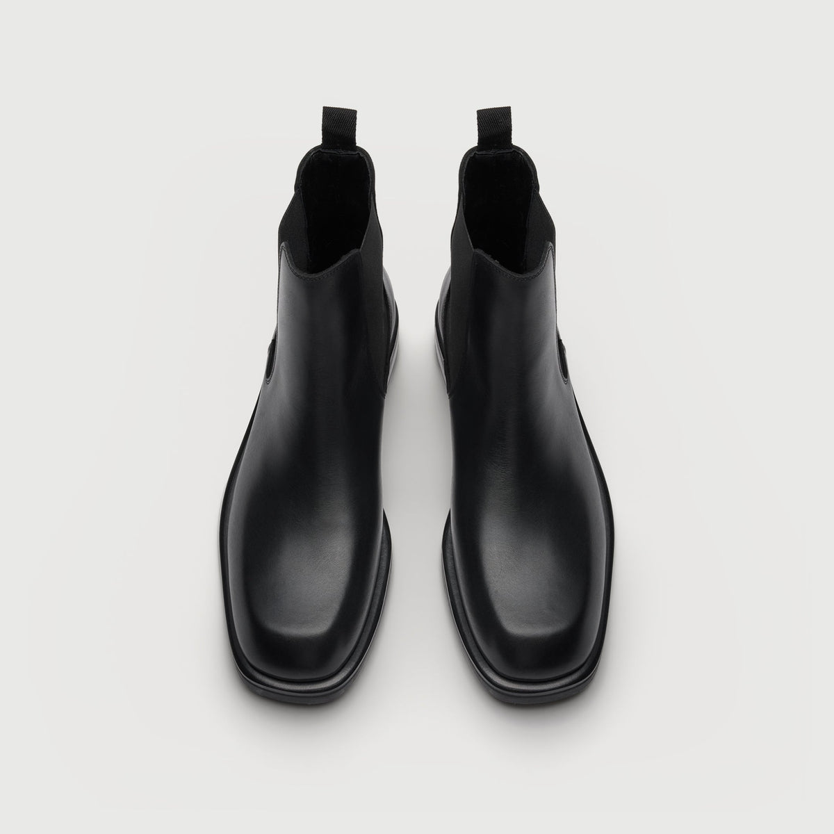 Walk London Lambeth Chelsea Boots in Black Leather top view showing extended ledge of sole and subtly squared sole, and pull tabs