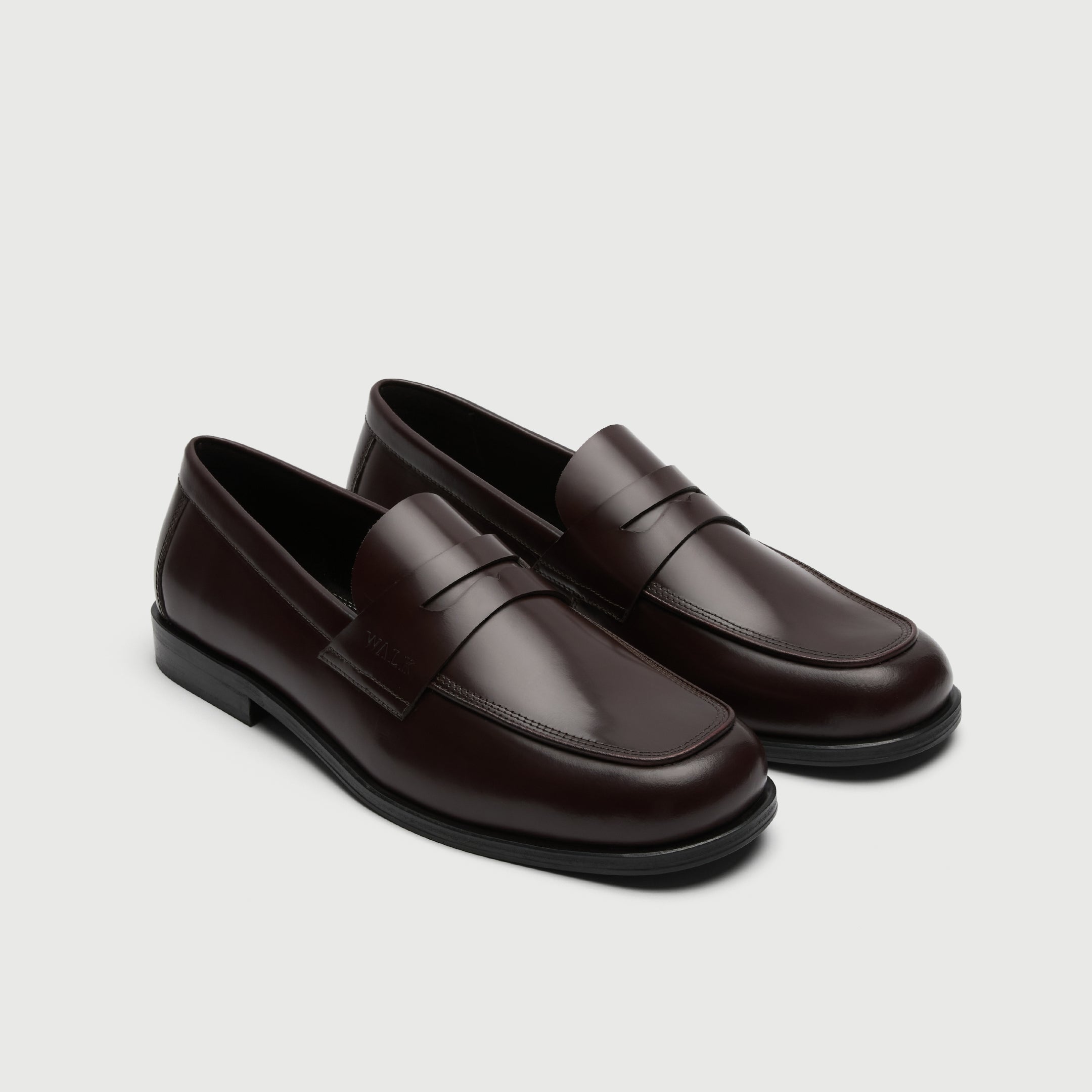 Walk London Marylebone Saddle Loafers in Dark Burgundy Leather three quarter view showing cut out in saddle strap and apron stitching