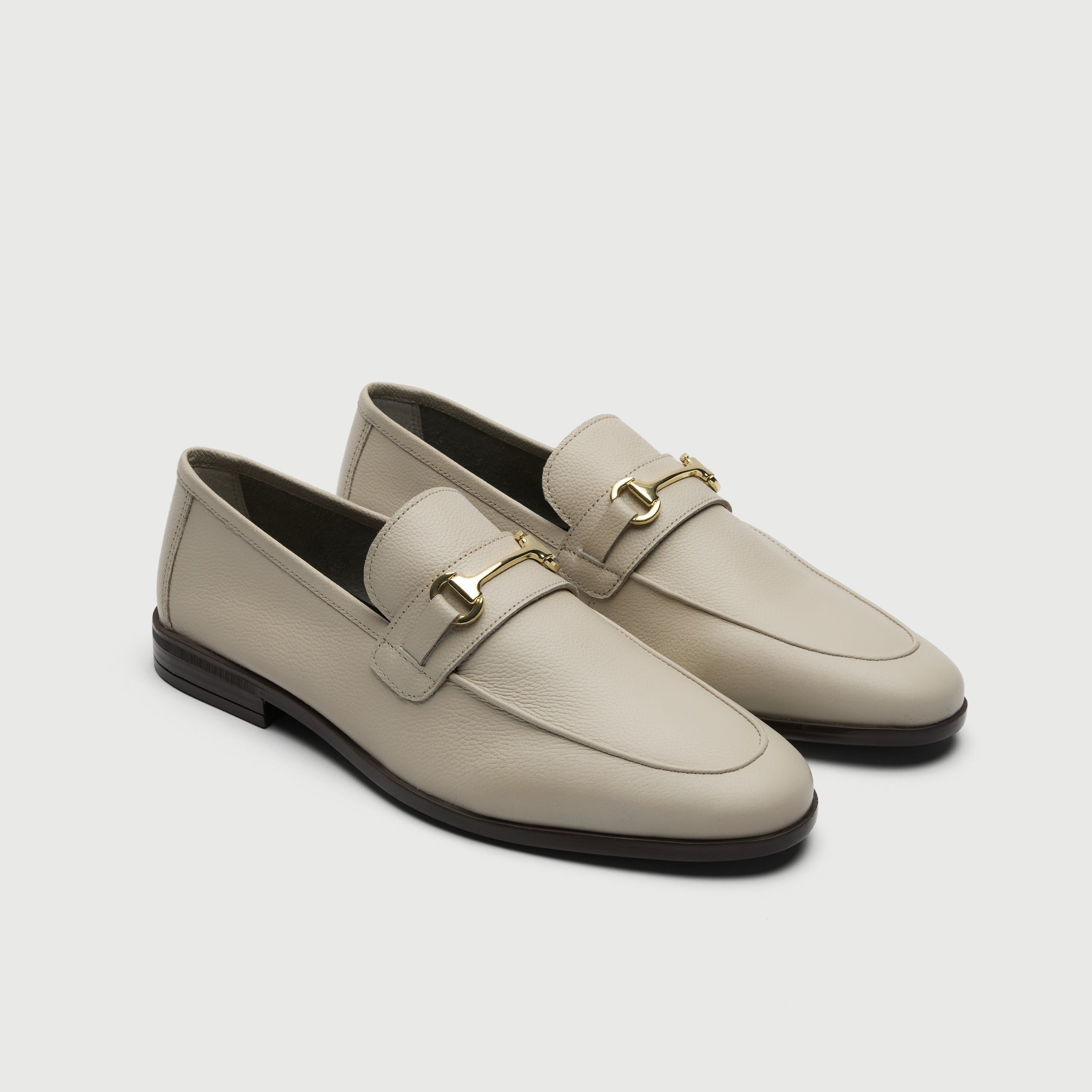 Walk London Naples Trim Cream Leather Loafer with gold horse bit detail three quarter view