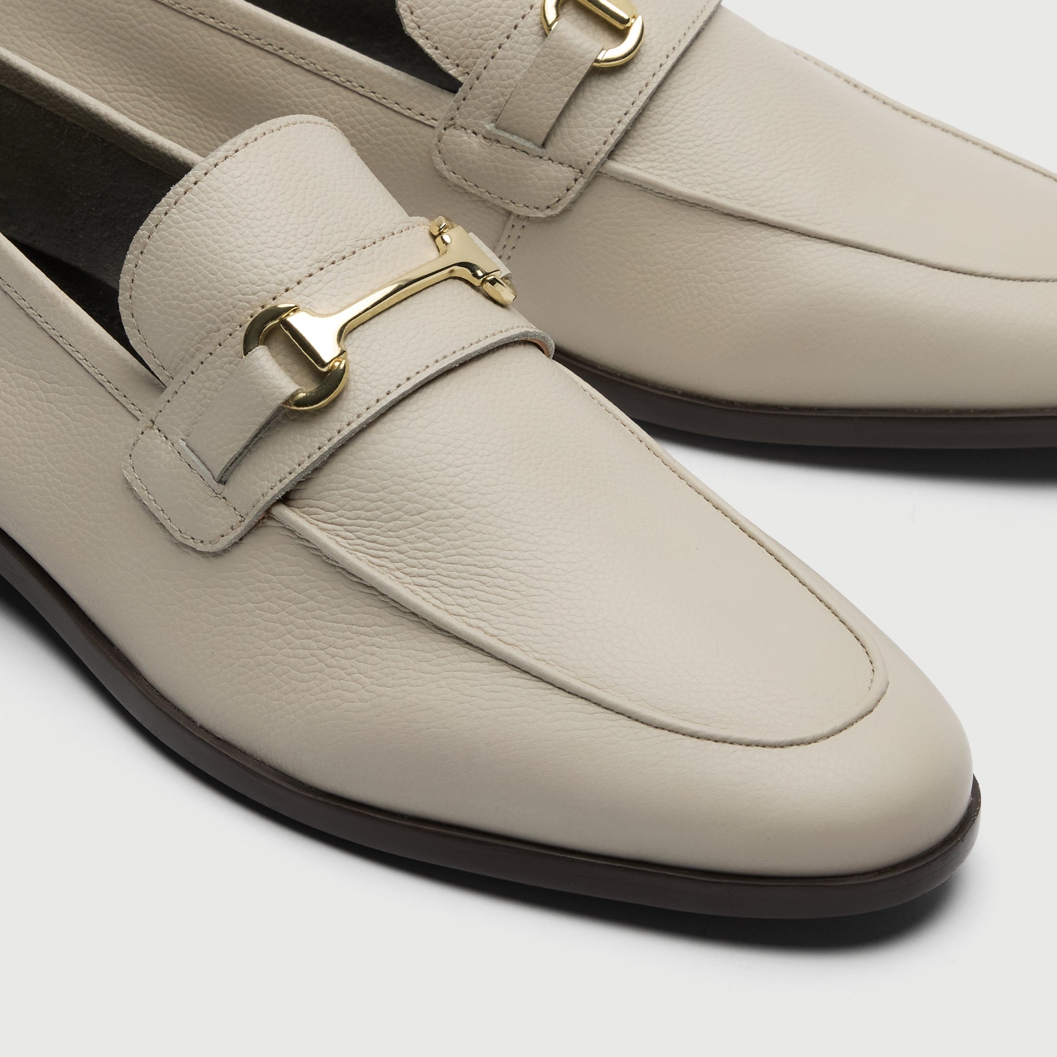 Walk London Naples Trim Cream Leather Loafer with gold horse bit detail close up of toe