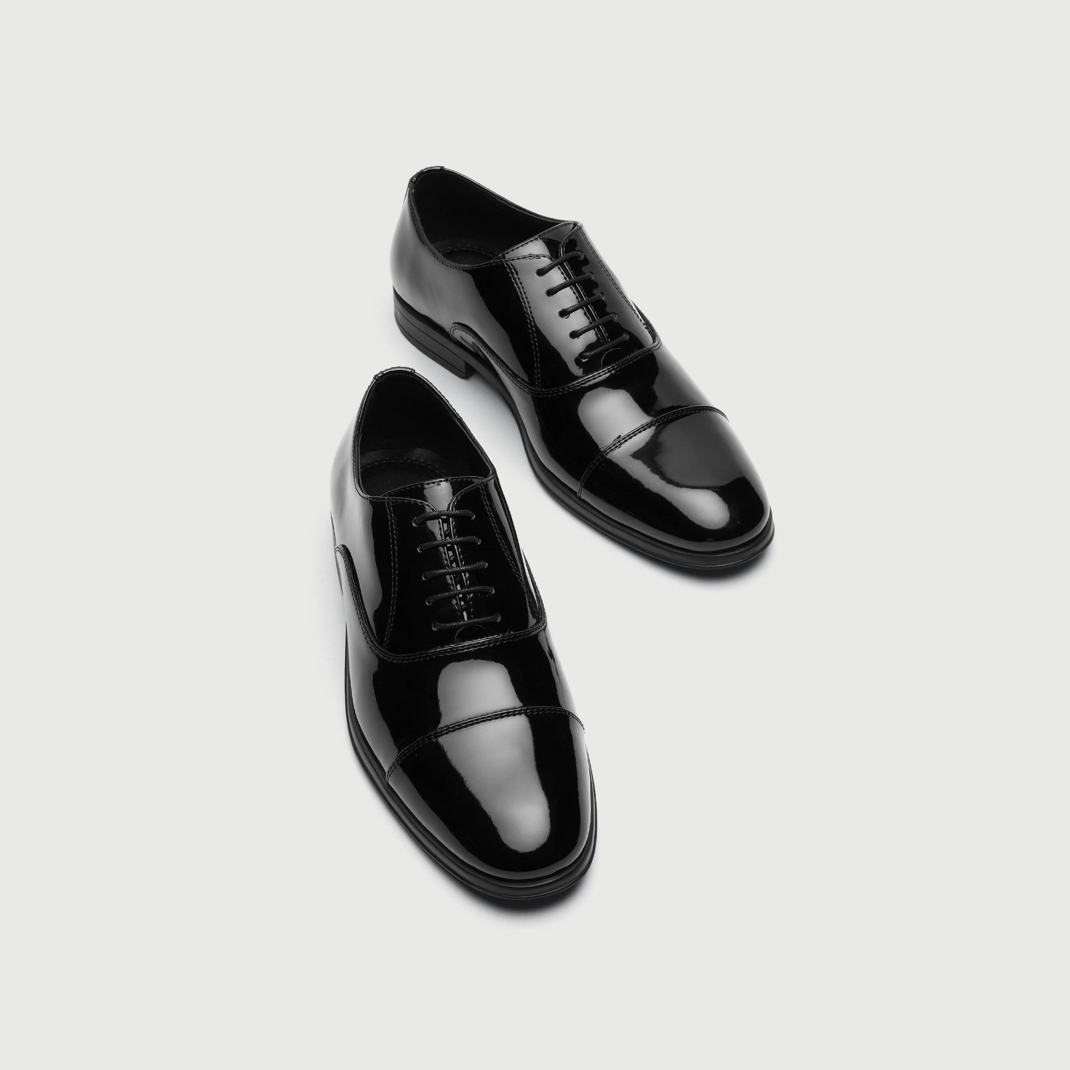 Walk London Oscar Black patent leather dress shoe on a light gray background