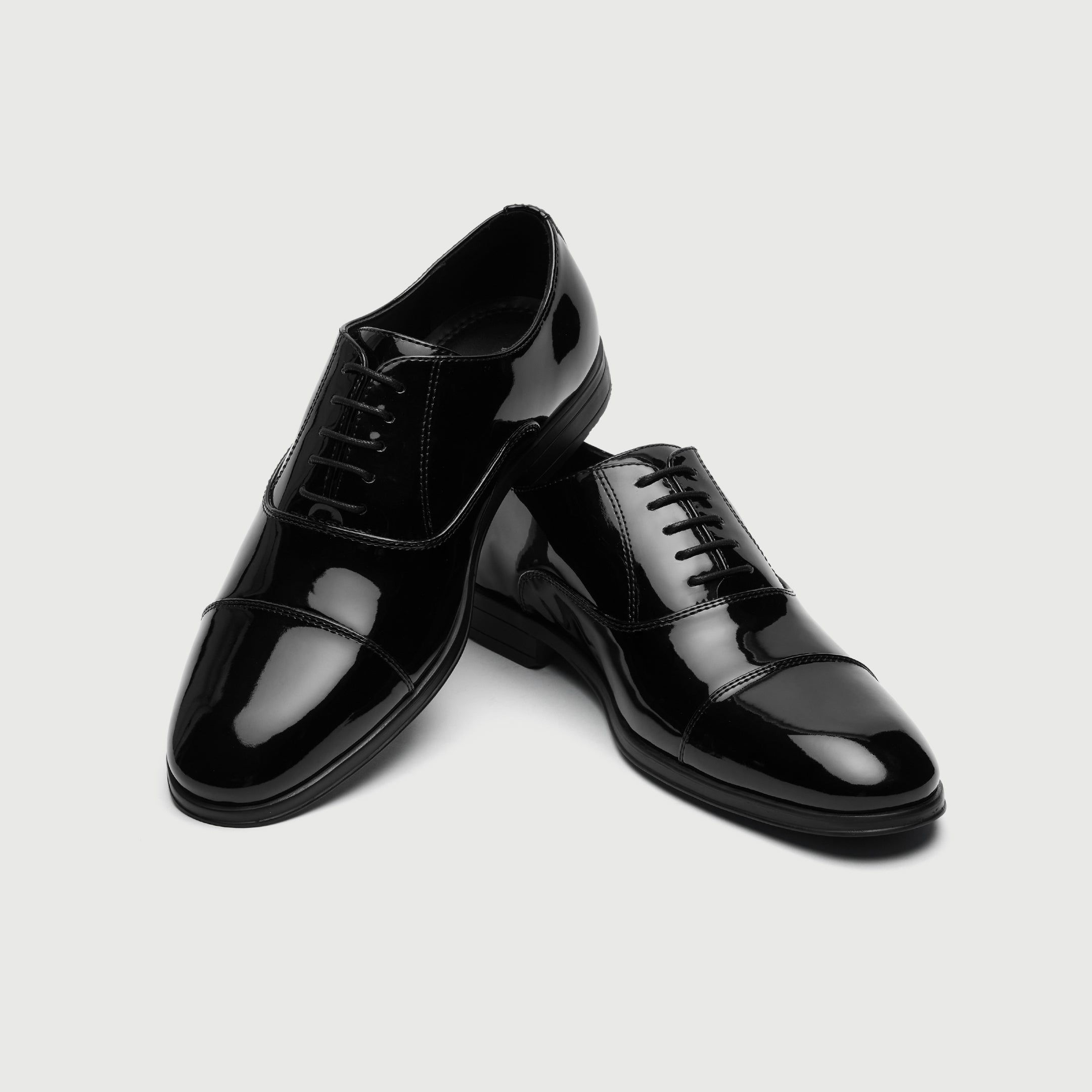 Walk London Oscar Black patent leather dress shoe on a light gray background
