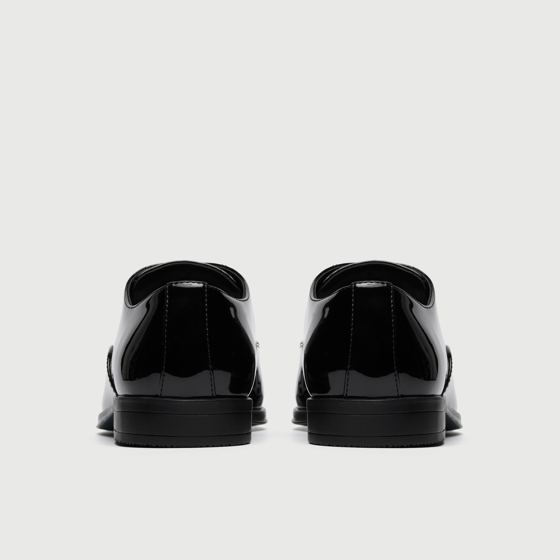 Walk London Oscar Black patent leather dress shoe on a light gray background