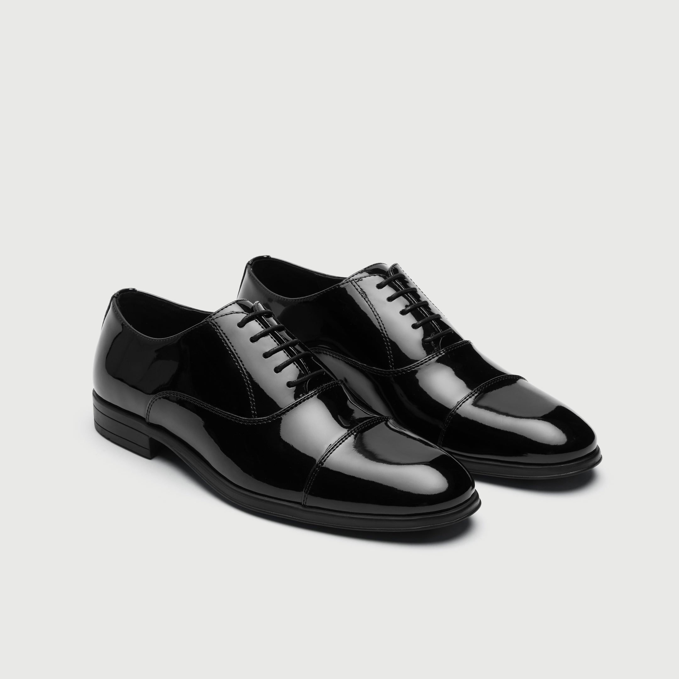 Walk London Oscar Black patent leather dress shoe on a light gray background