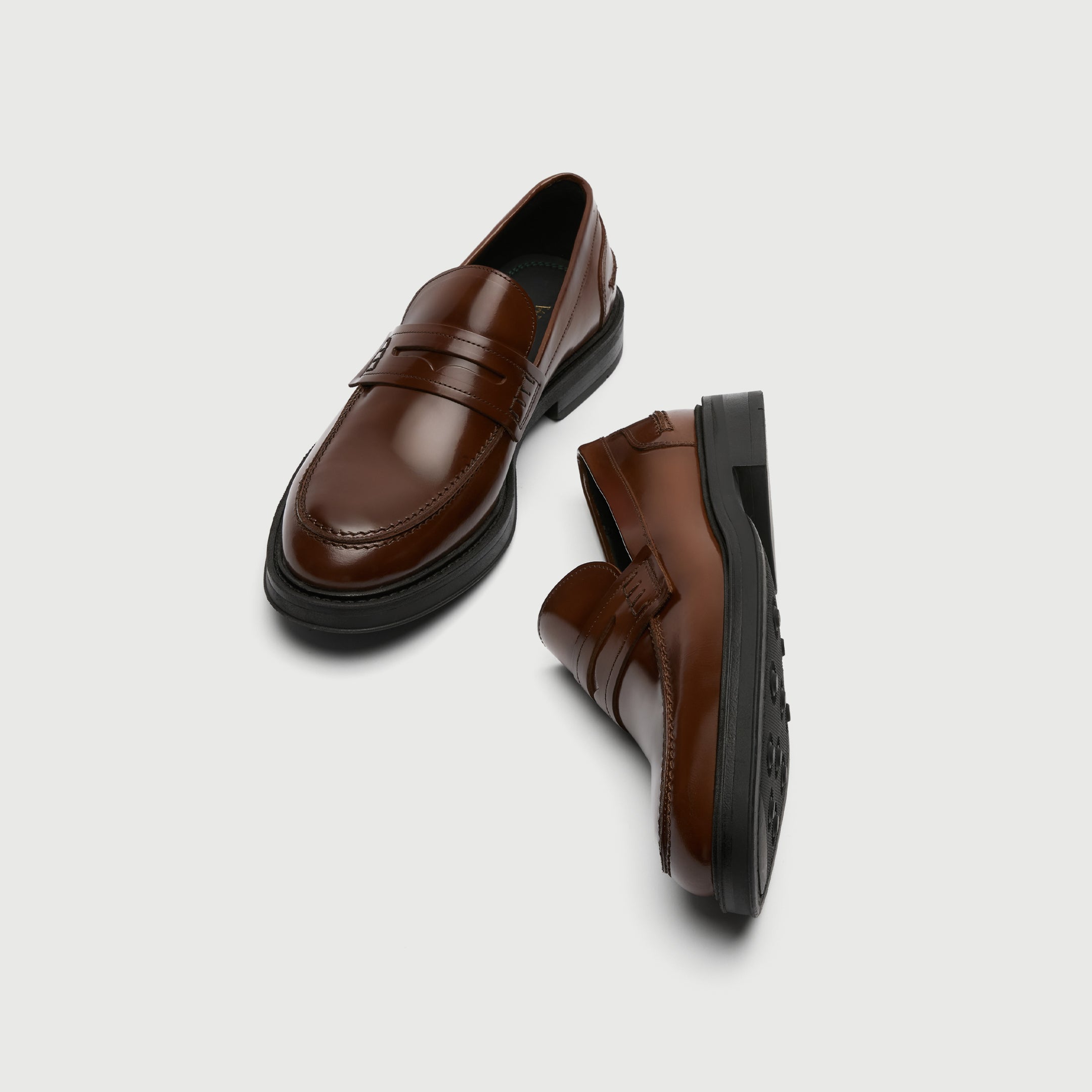 Pair of brown leather shoes on a light gray background - Walk London Parsons Saddle Loafer in Tan Leather top View