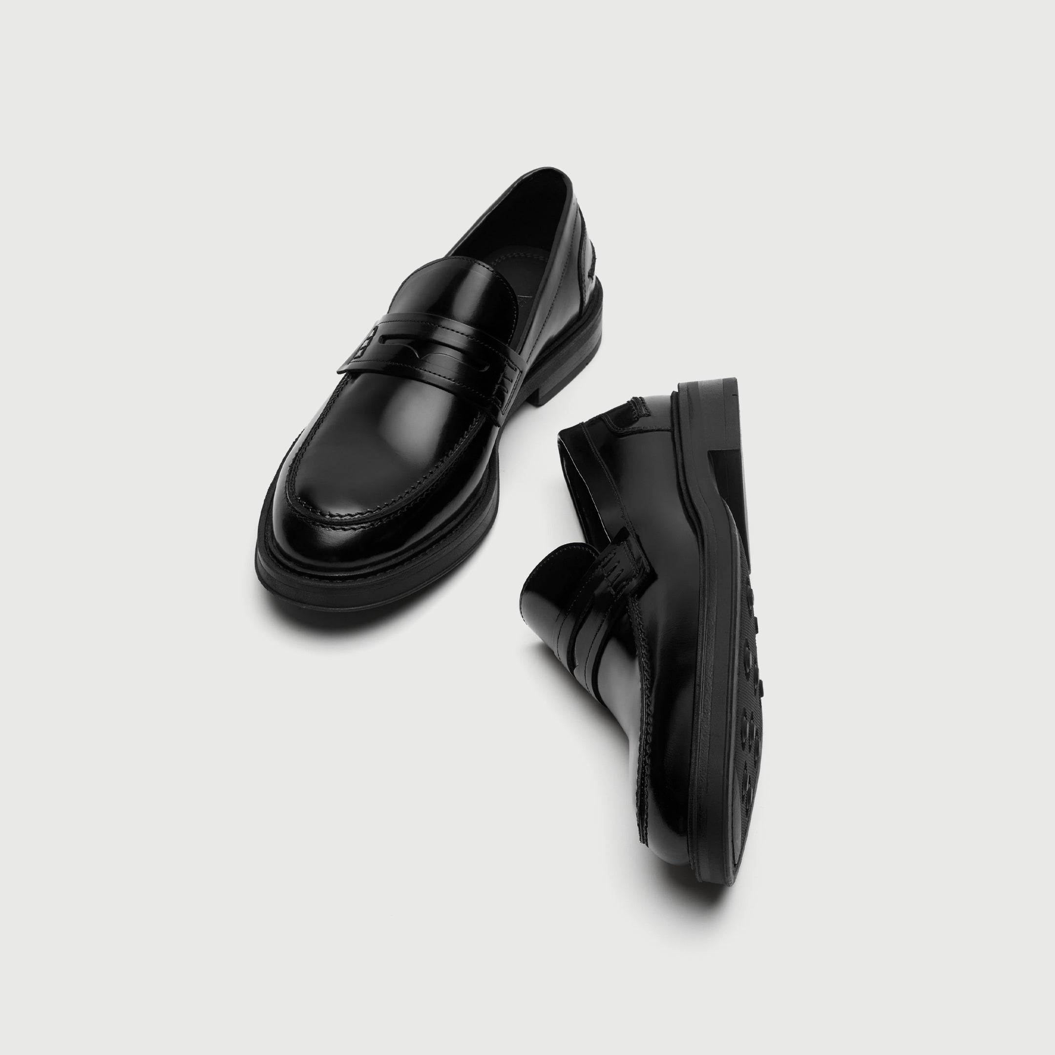 Pair of black leather loafers on a light gray background - Walk London Parsons Saddle Loafer in Black Leather Top View
