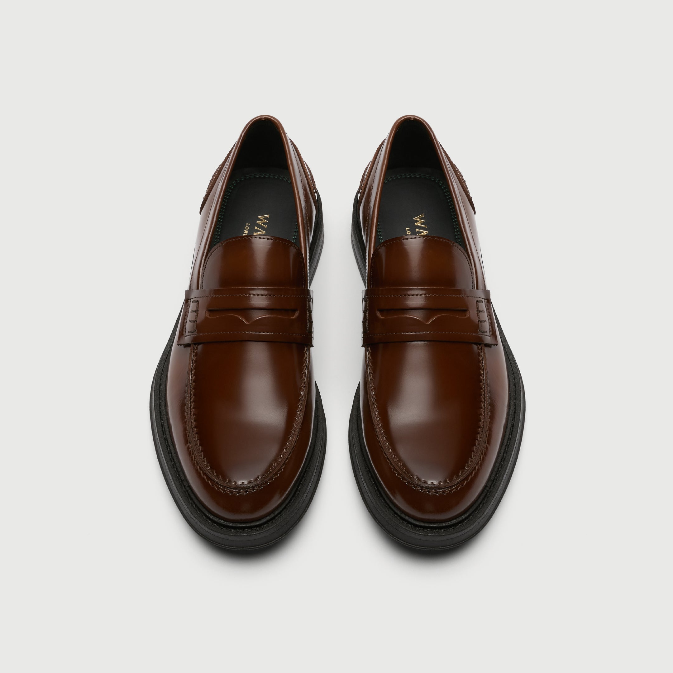 Pair of brown leather shoes on a light gray background - Walk London Parsons Saddle Loafer in Tan Leather Birds eye View