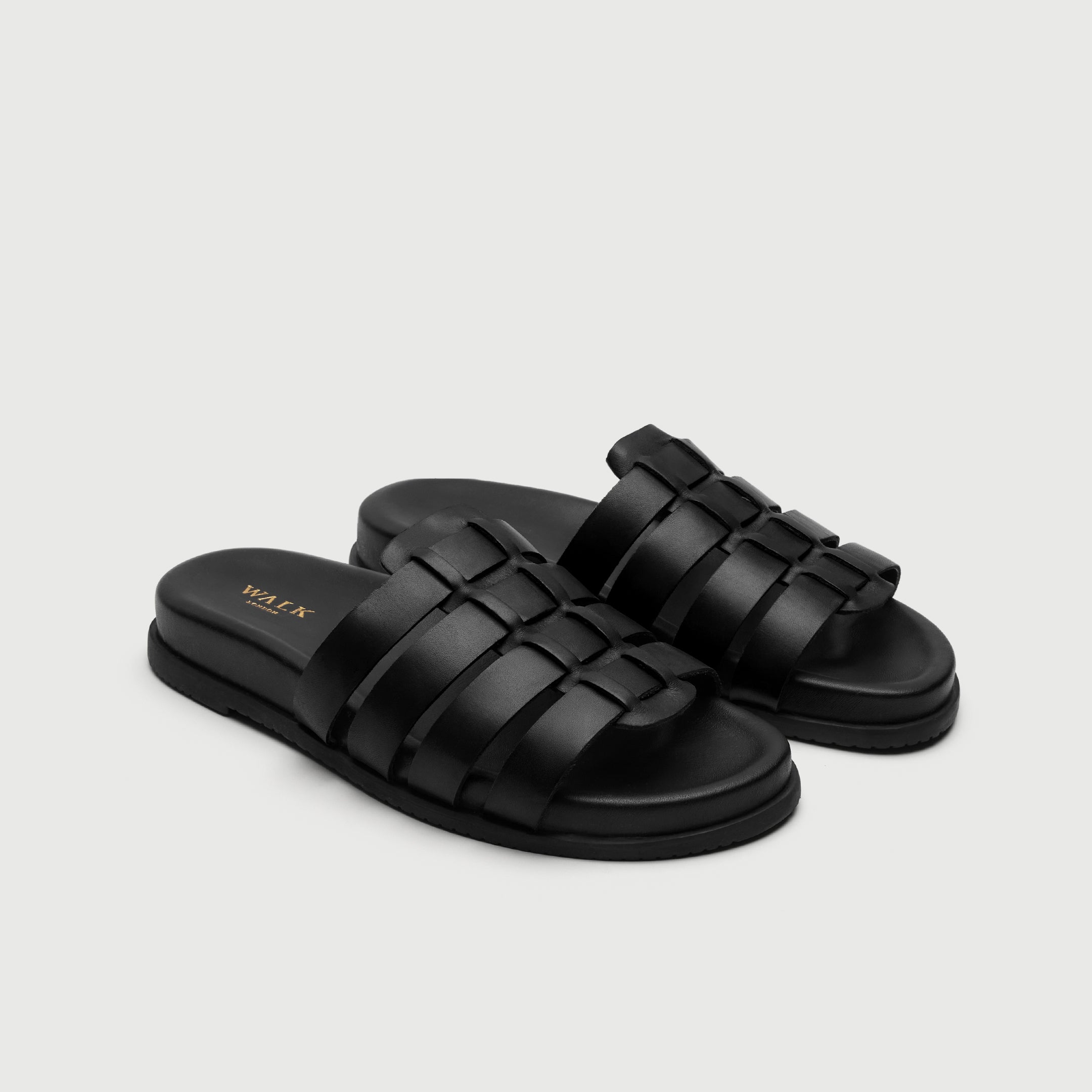 Video of man wearing Walk London Breeze Gladiator Men's Black Leather Sandals with wide khaki trousers