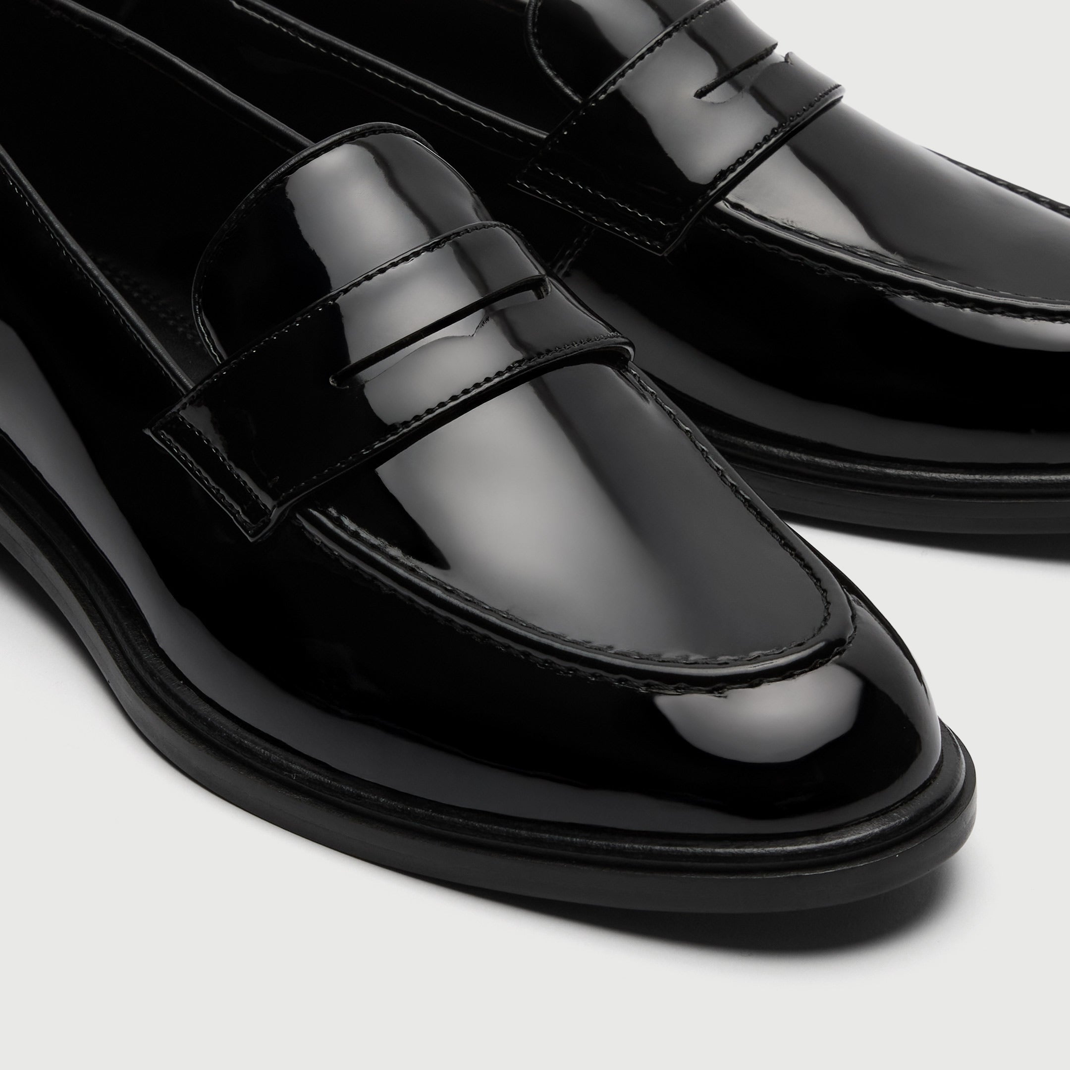 Walk London Putney Black Patent Loafer detail view of toe and saddle