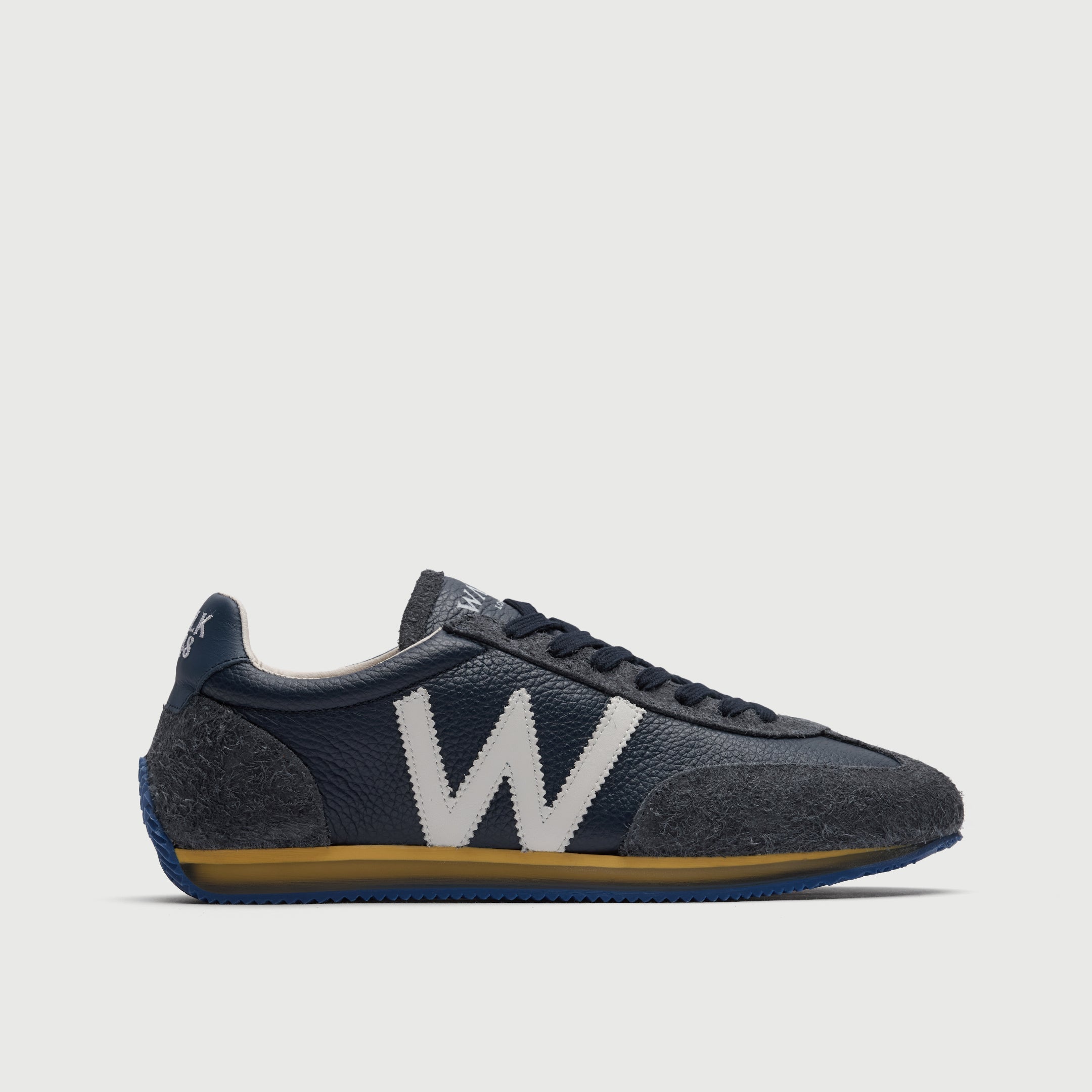 Walk London Retro Runner Trainer in Blue Brushed Suede and Grain Leather side view showing white 'w' detail, yellow and translucent midsole and blue outsole