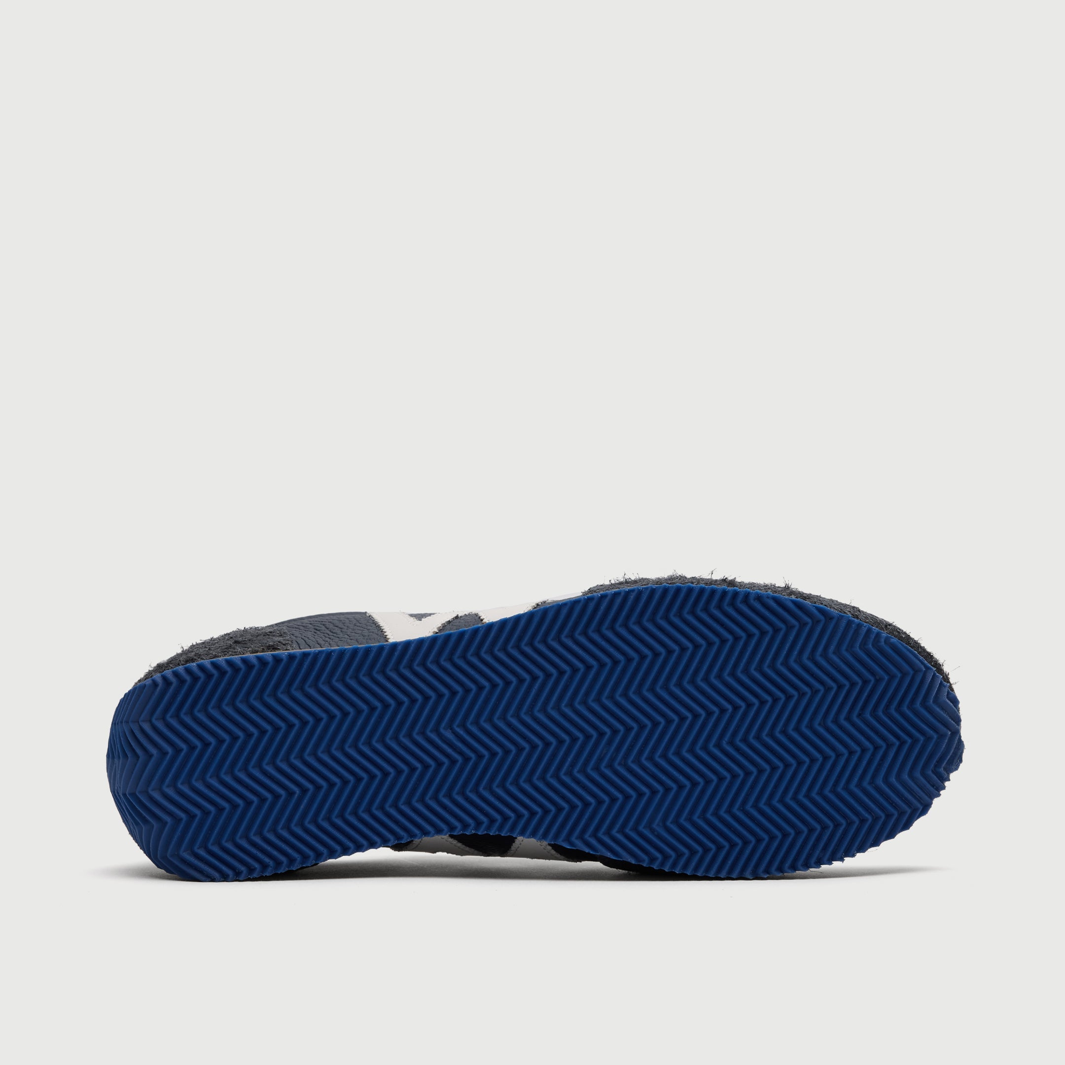 Walk London Retro Runner Trainers in Blue Brushed Suede and Grain Leather sole view showing ridged zig-zag blue sole