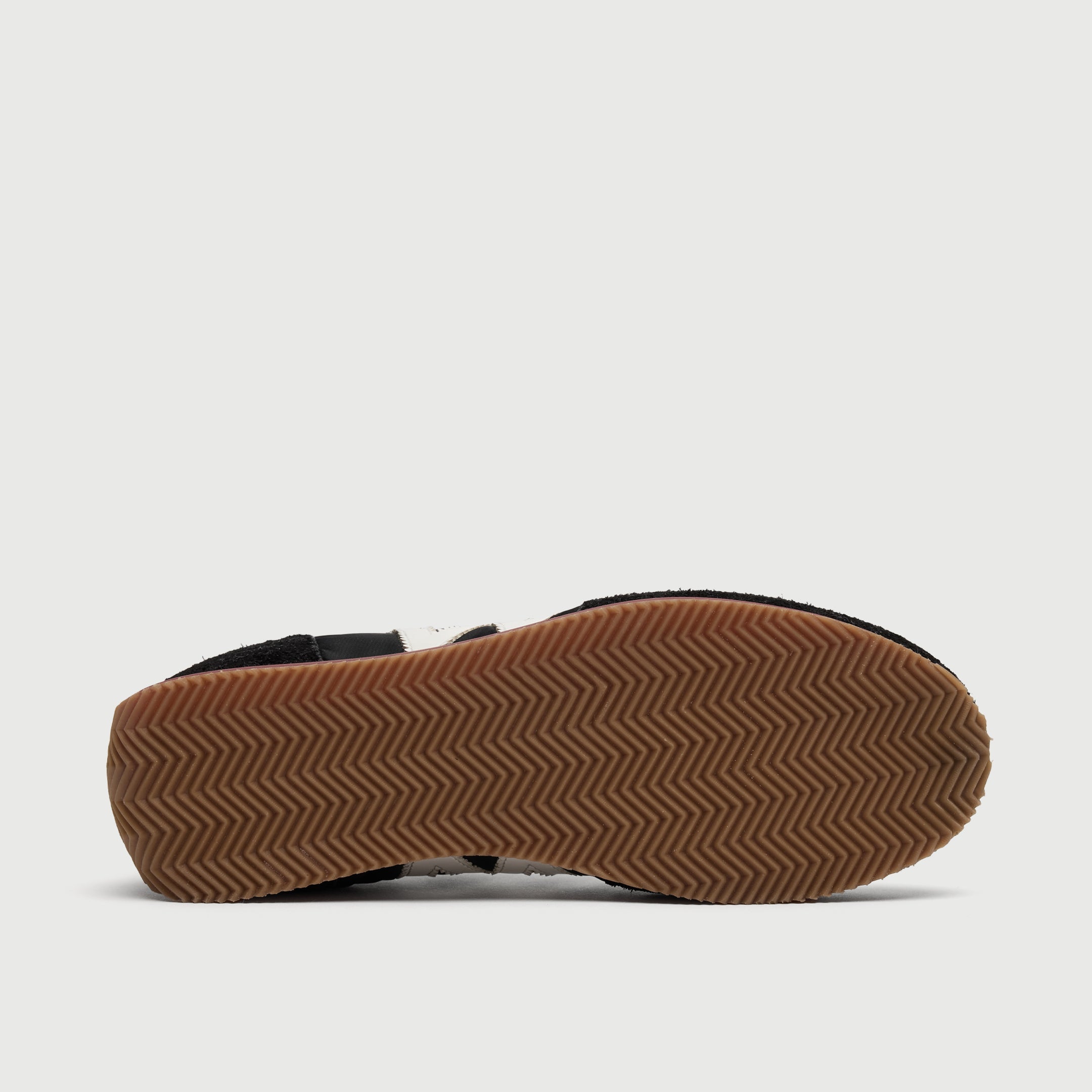 Walk London Retro Runner Trainer in Black Brushed Suede and Textile sole view showing ridged zig-zag tan sole