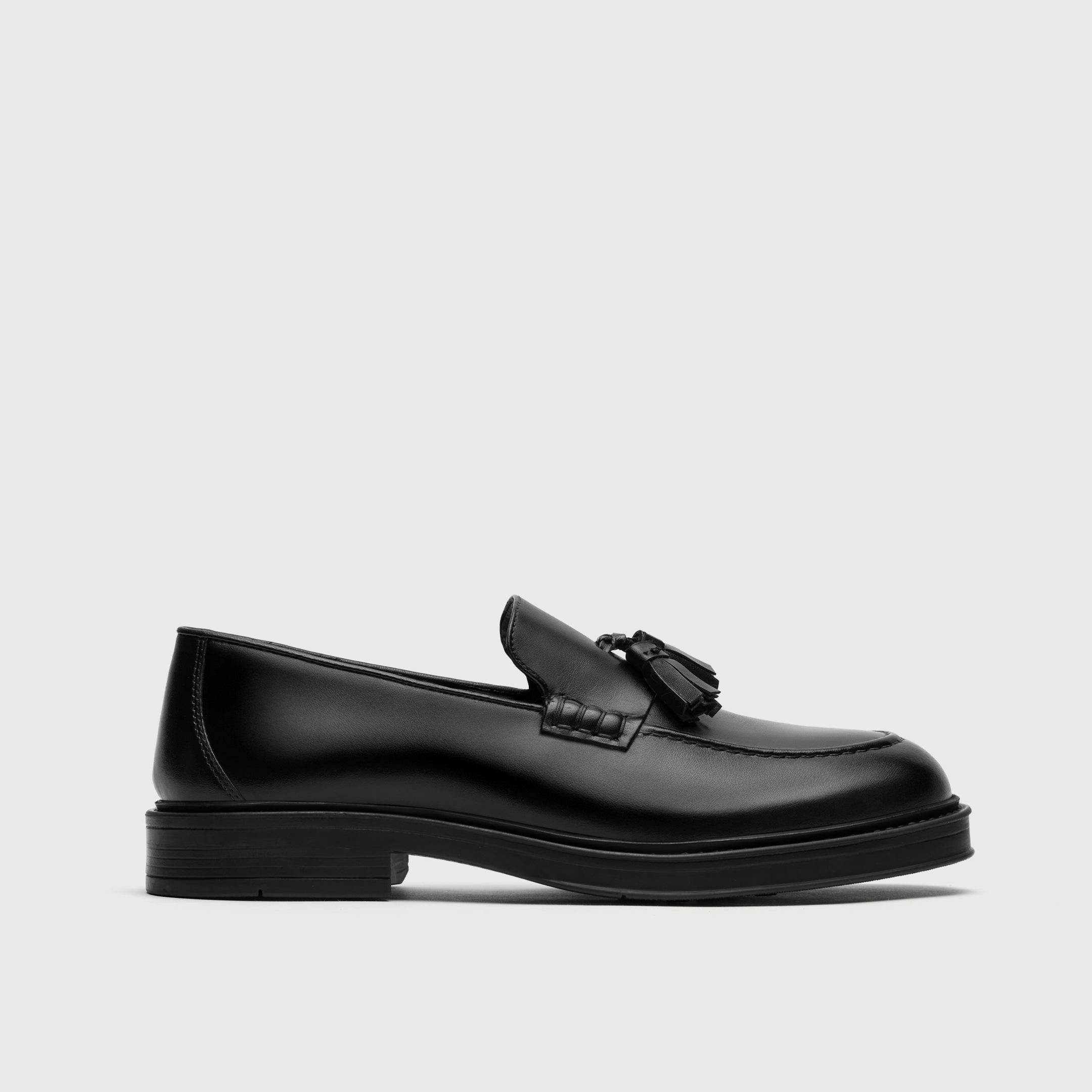 Walk London Richmond Tassel Loafer in Black Leather side view showing double tassel and beefroll stitch detail