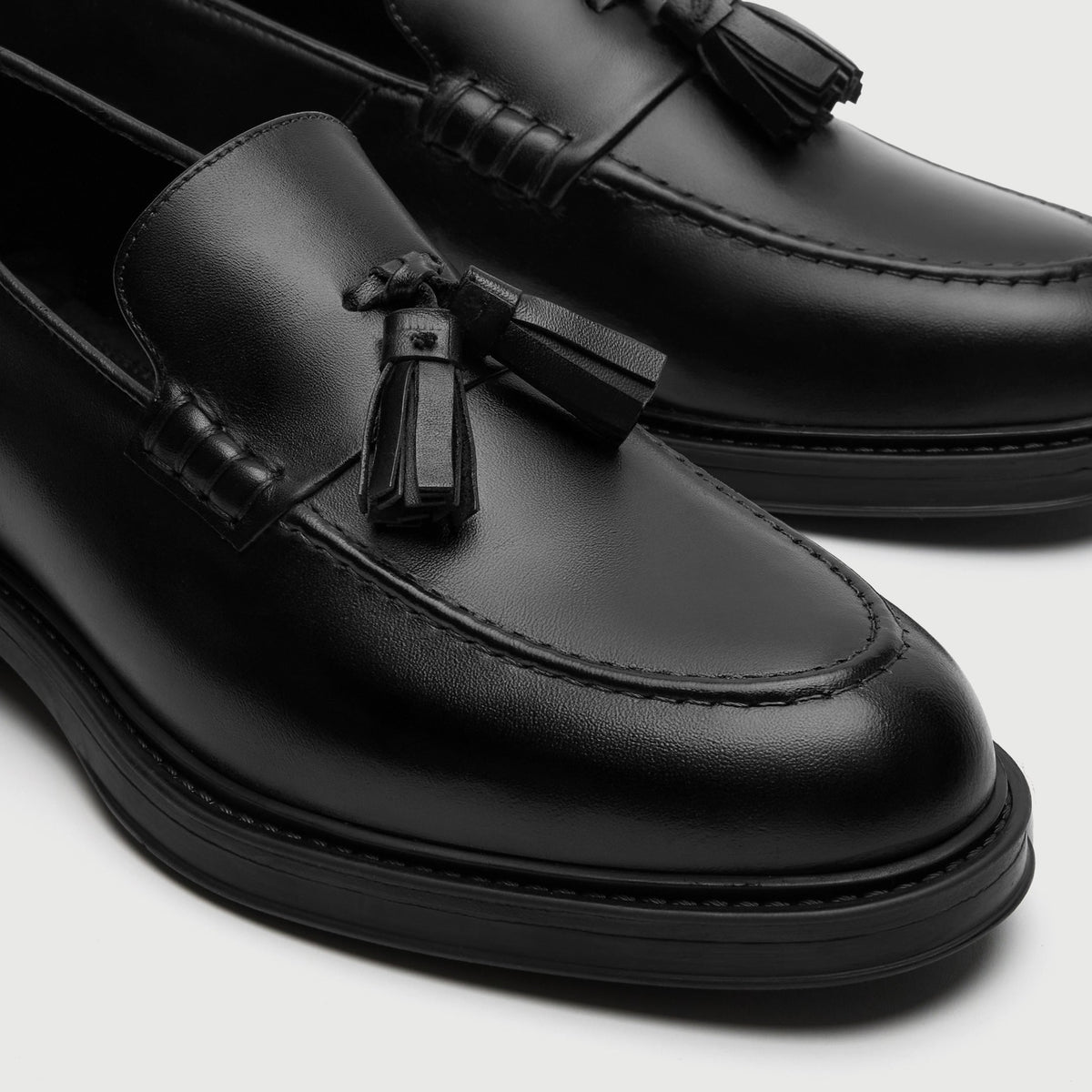 Walk London Richmond Tassel Loafers in Black Leather close up of tassels and beefroll and apron stitching on the toe