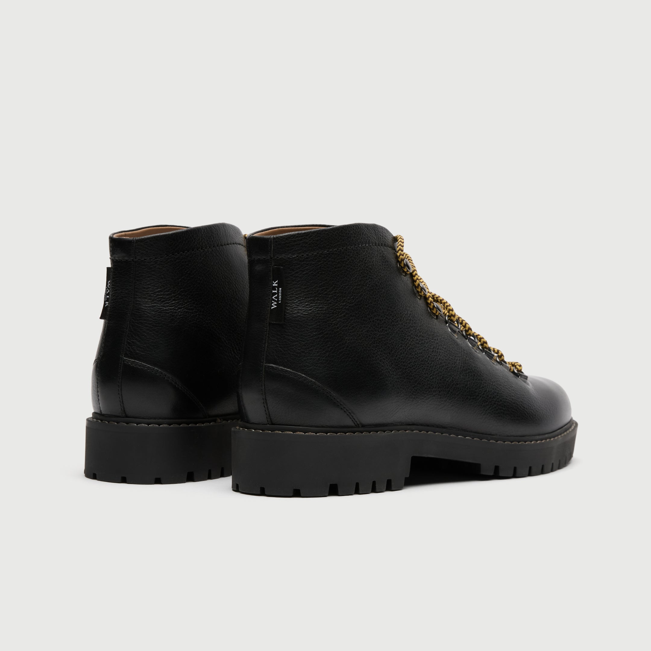 Walk London Sean low hiking boots in black leather and yellow lace