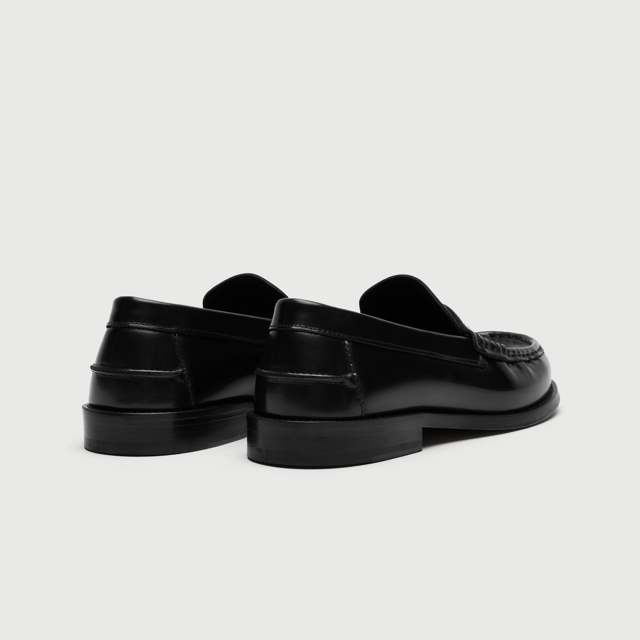 Walk London Shoreditch Penny Loafers in Black Leather heel view showing heel counter horizontal seam