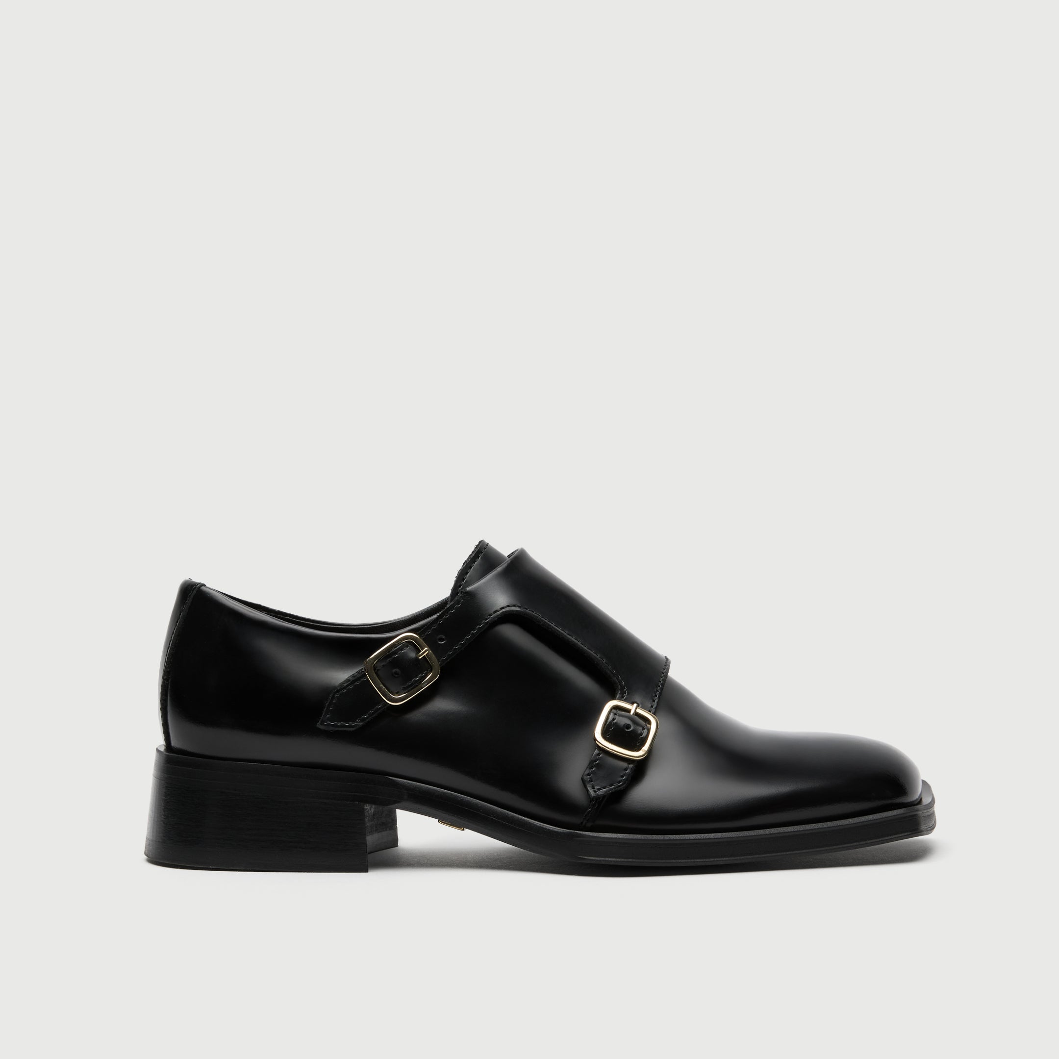 Black leather shoe with a buckle on a light grey background - Walk London Abbey Monk Shoe
