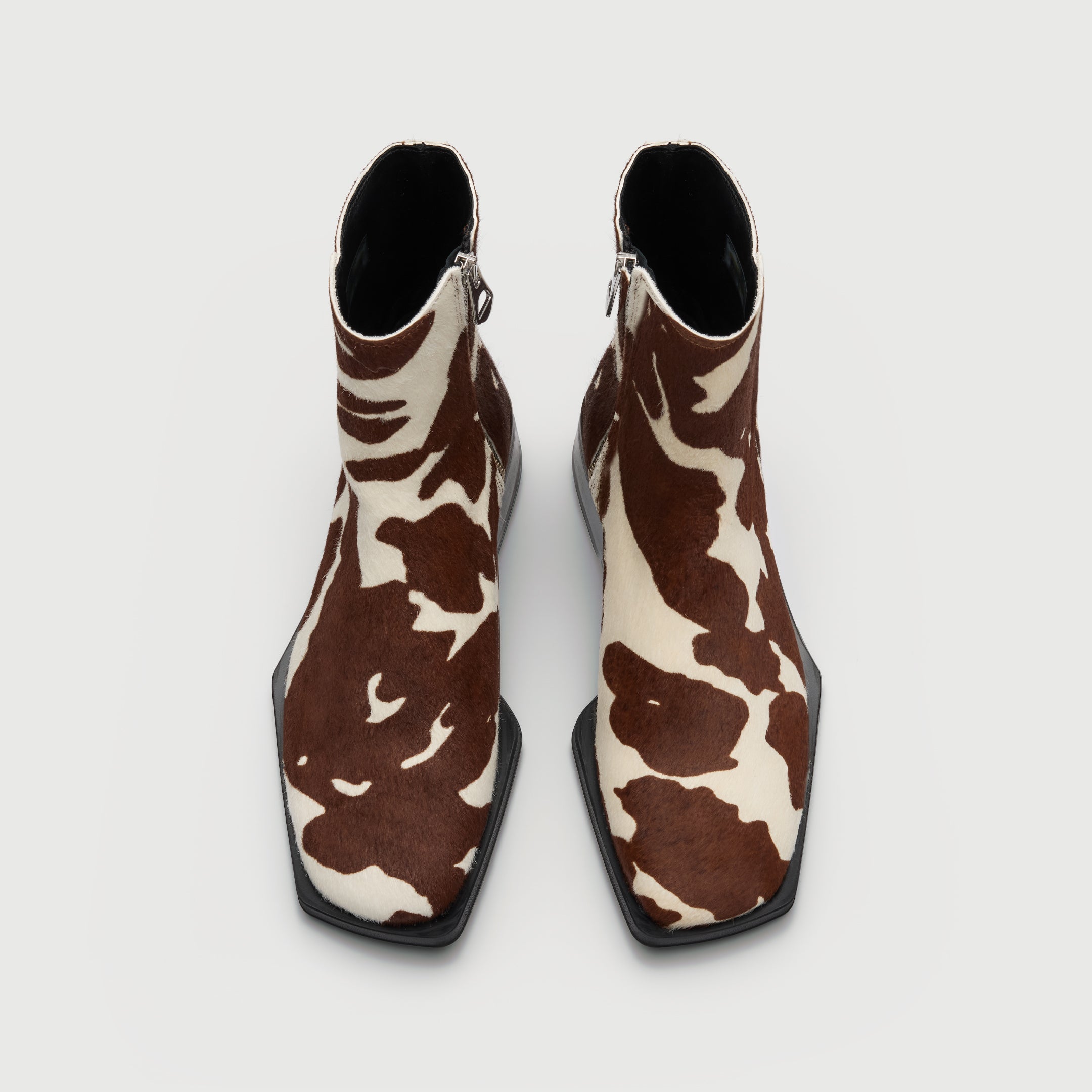 Walk London Abbey Zip Up Cuban Heel Ankle Boots in brown and white cow print hair on leather top view