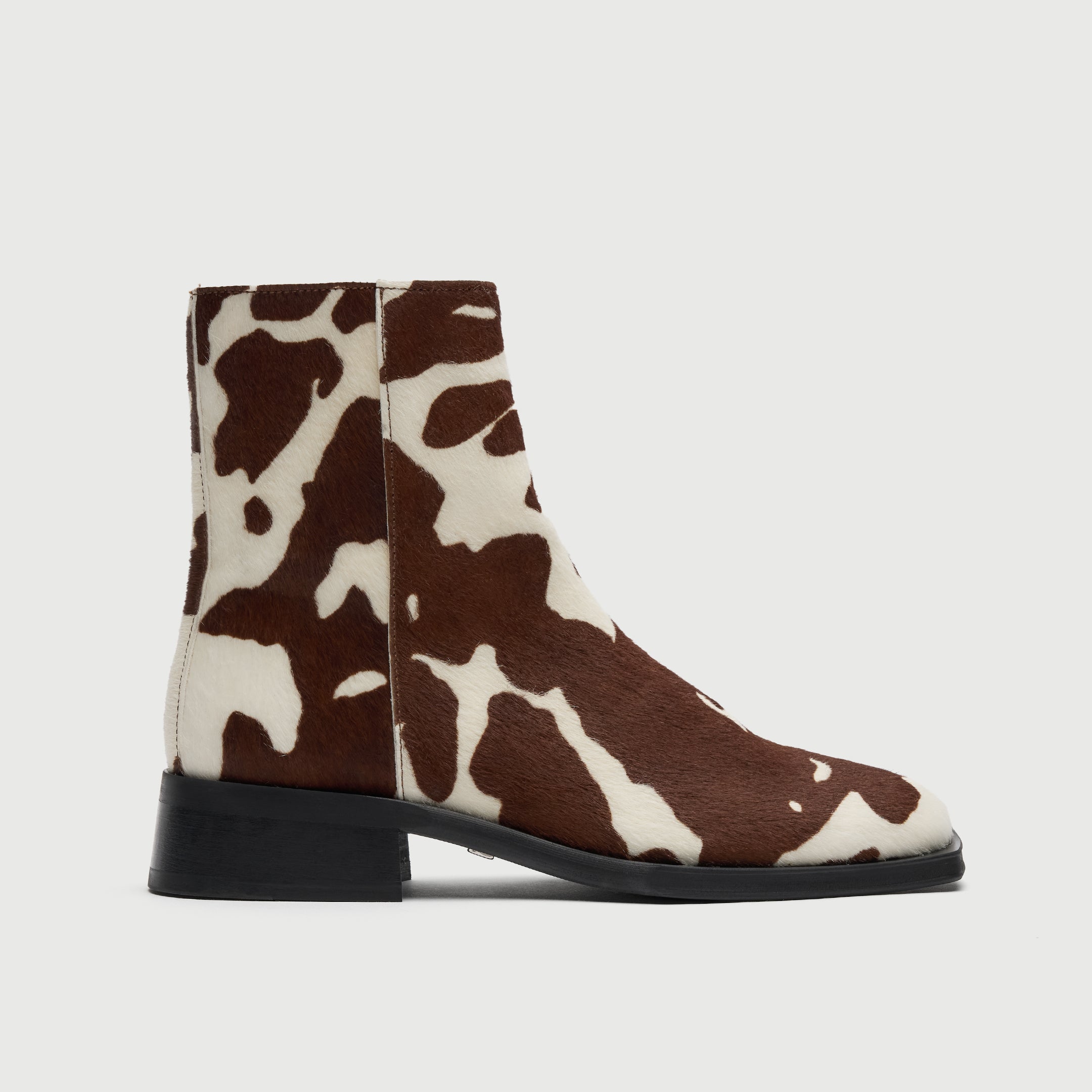 Walk London Abbey Zip Up Cuban Heel Ankle Boots in brown and white cow print hair on leather side view