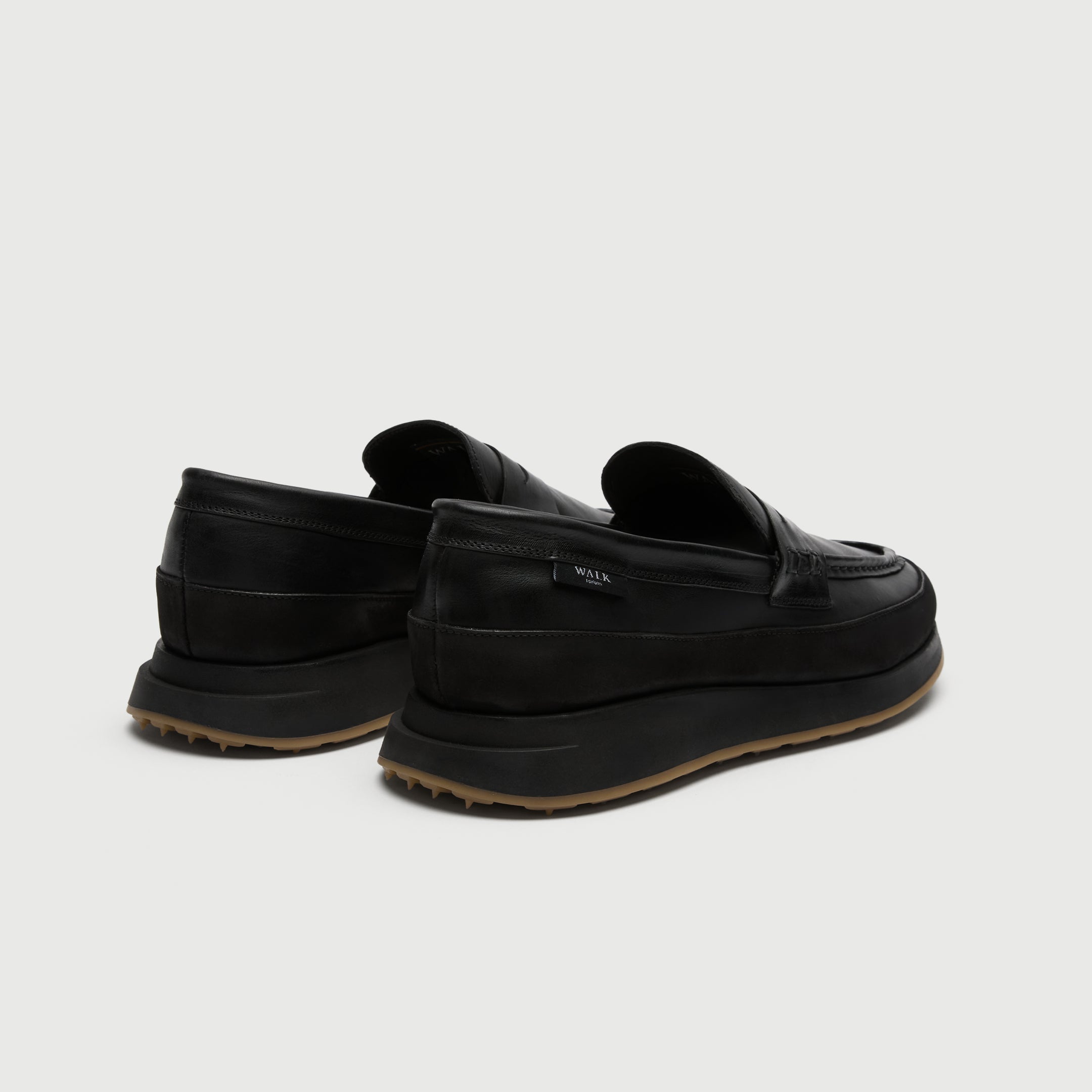 Walk London Battersea Saddle Hybrid Loafer in black leather heel view showing branded tag
