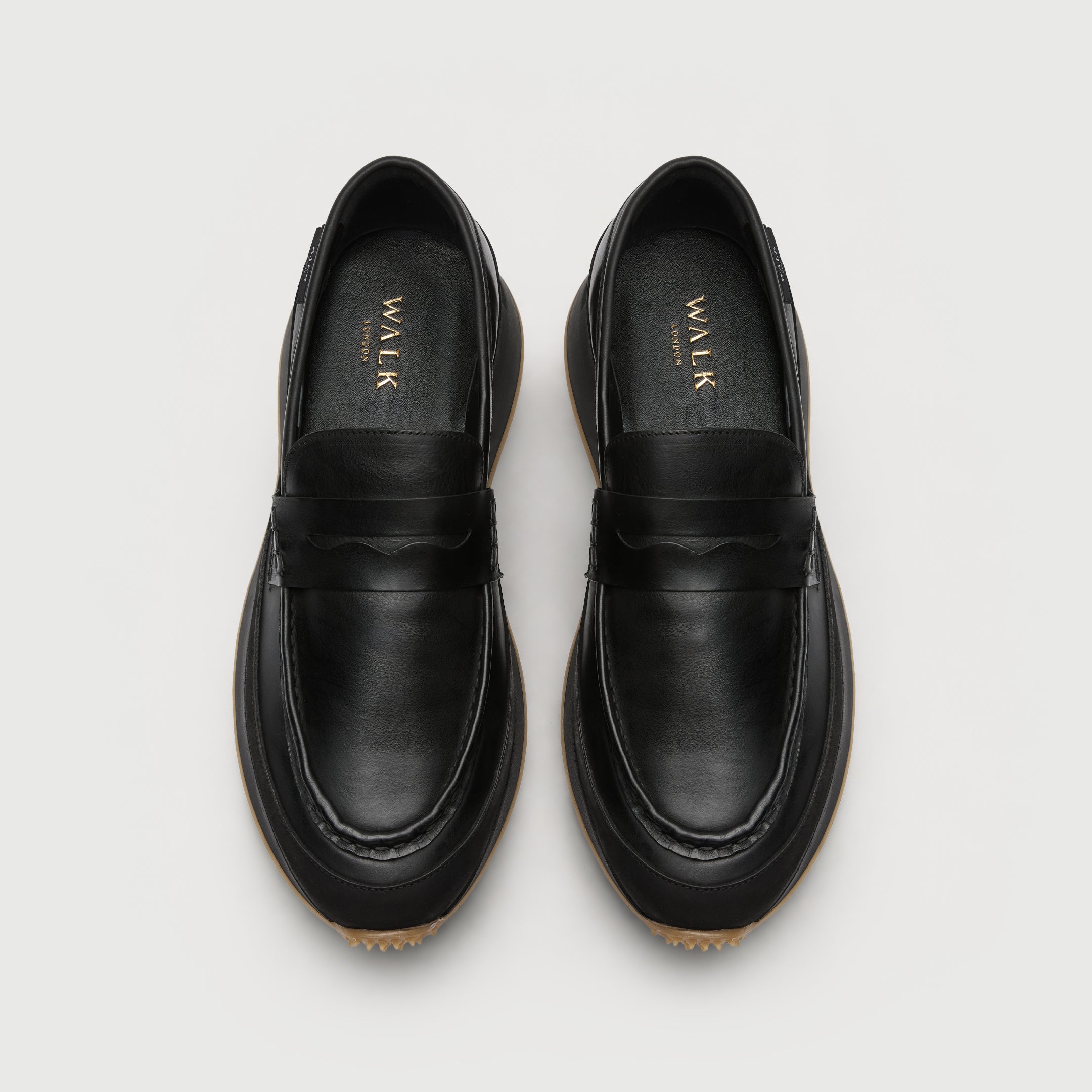 Walk London Battersea Saddle Hybrid Loafer in black leather top view showing gold foil branding on the insock.