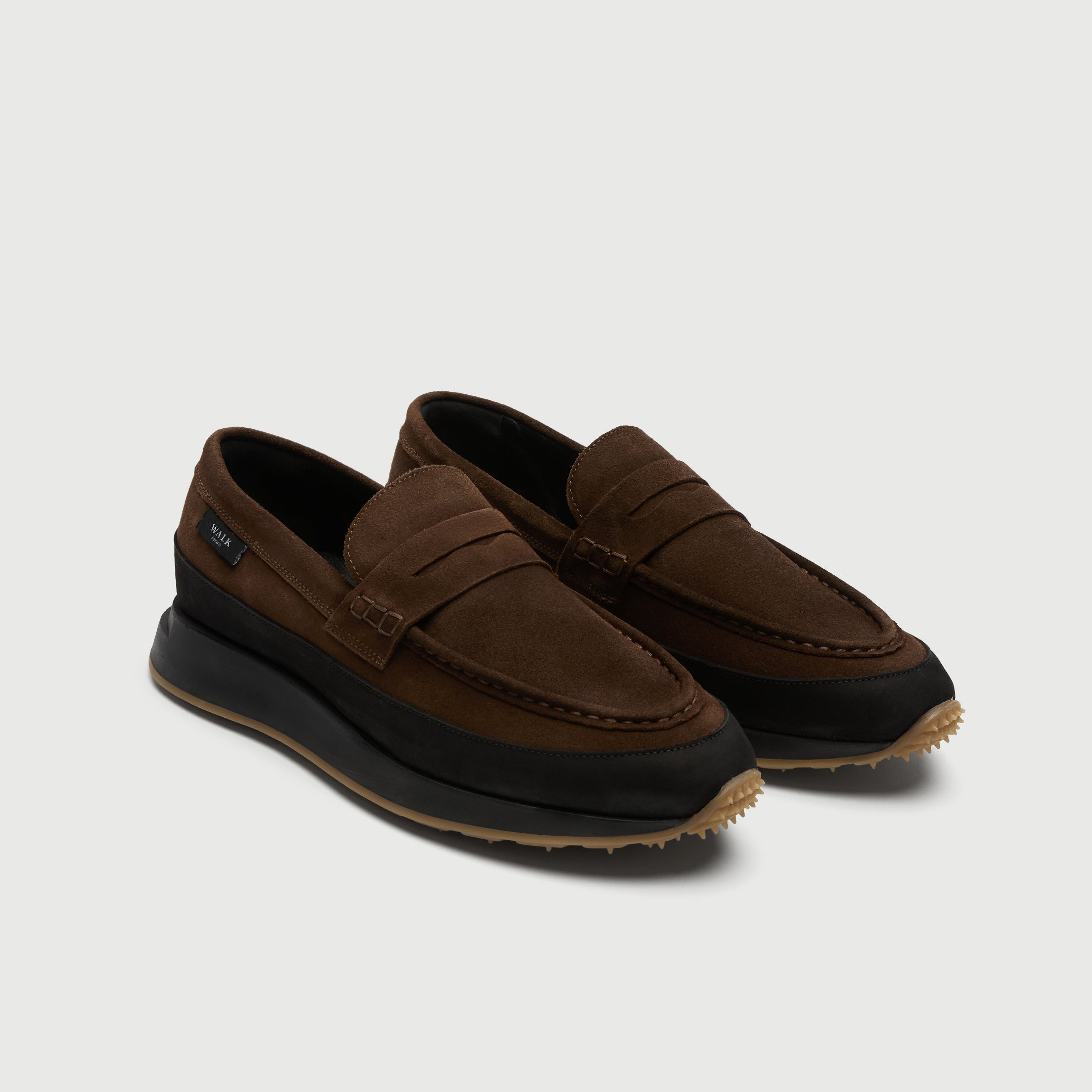 Walk London Battersea Saddle Hybrid Loafer in brown and black suede three quarter view